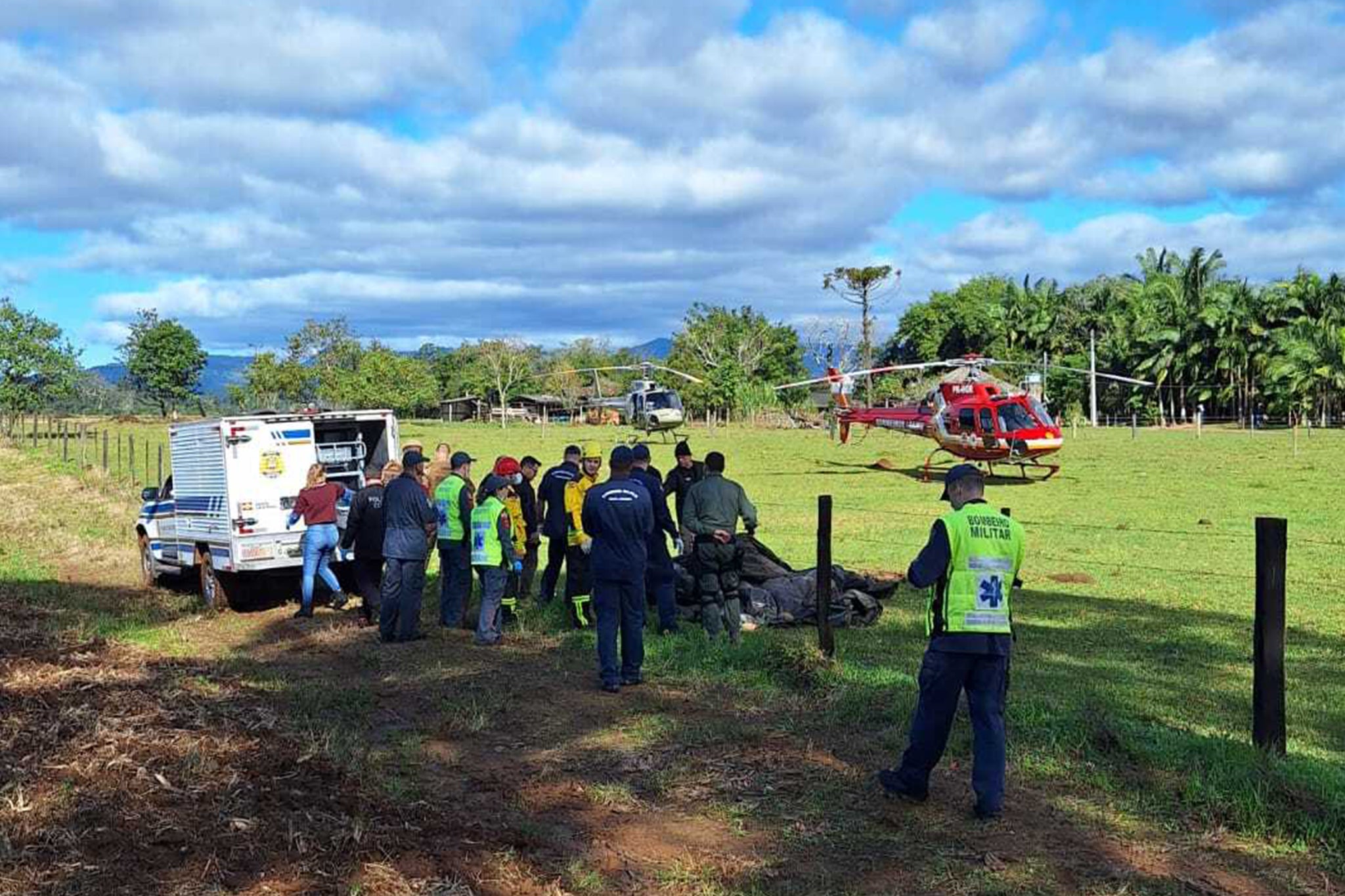 Emergency services pictured at the scene following the crash in Santa Catarina, Brazil on Saturday