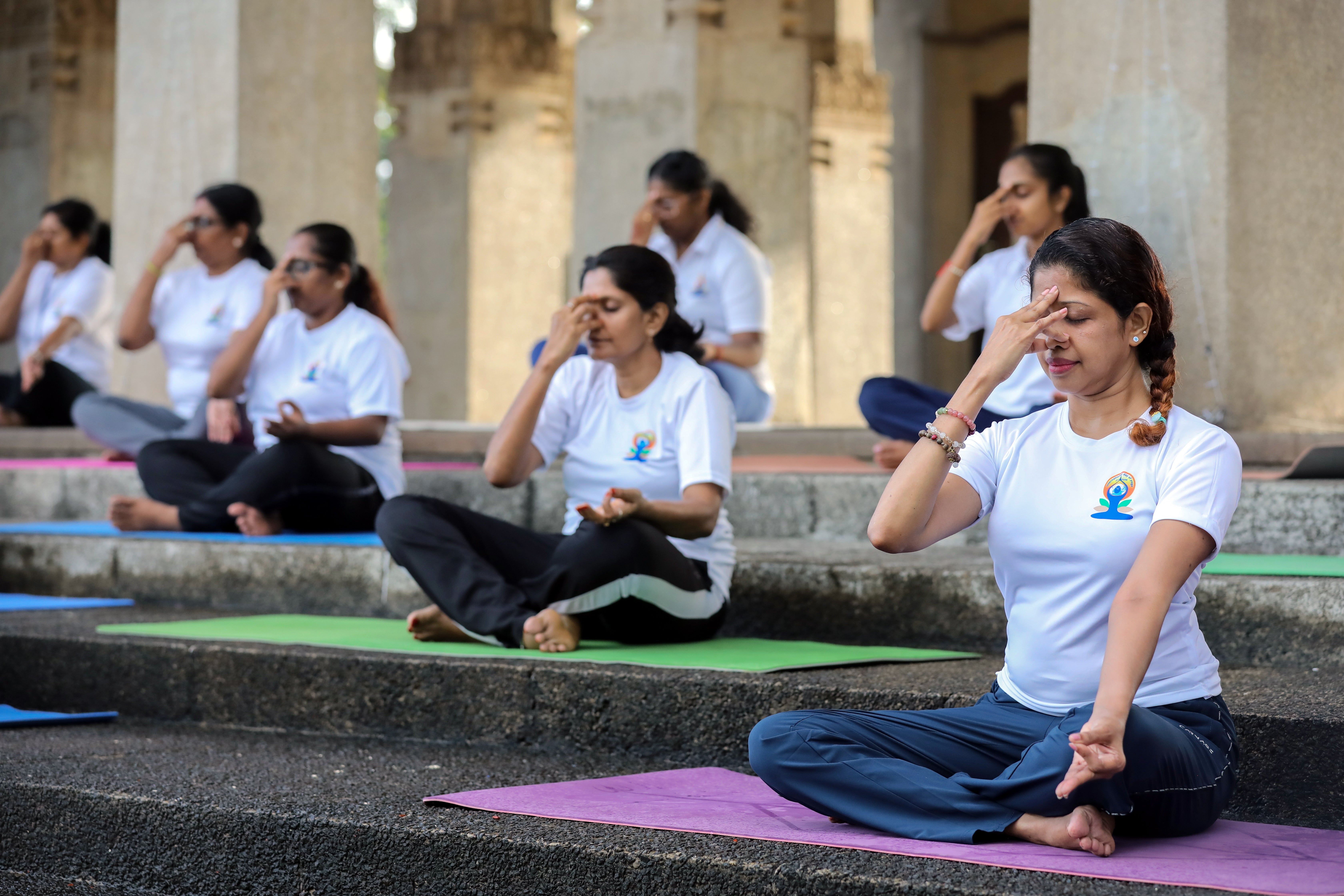 Yoga enthusiasts participate in a yoga session organised by the High Commission of India at Independence Square in Colombo, Sri Lanka