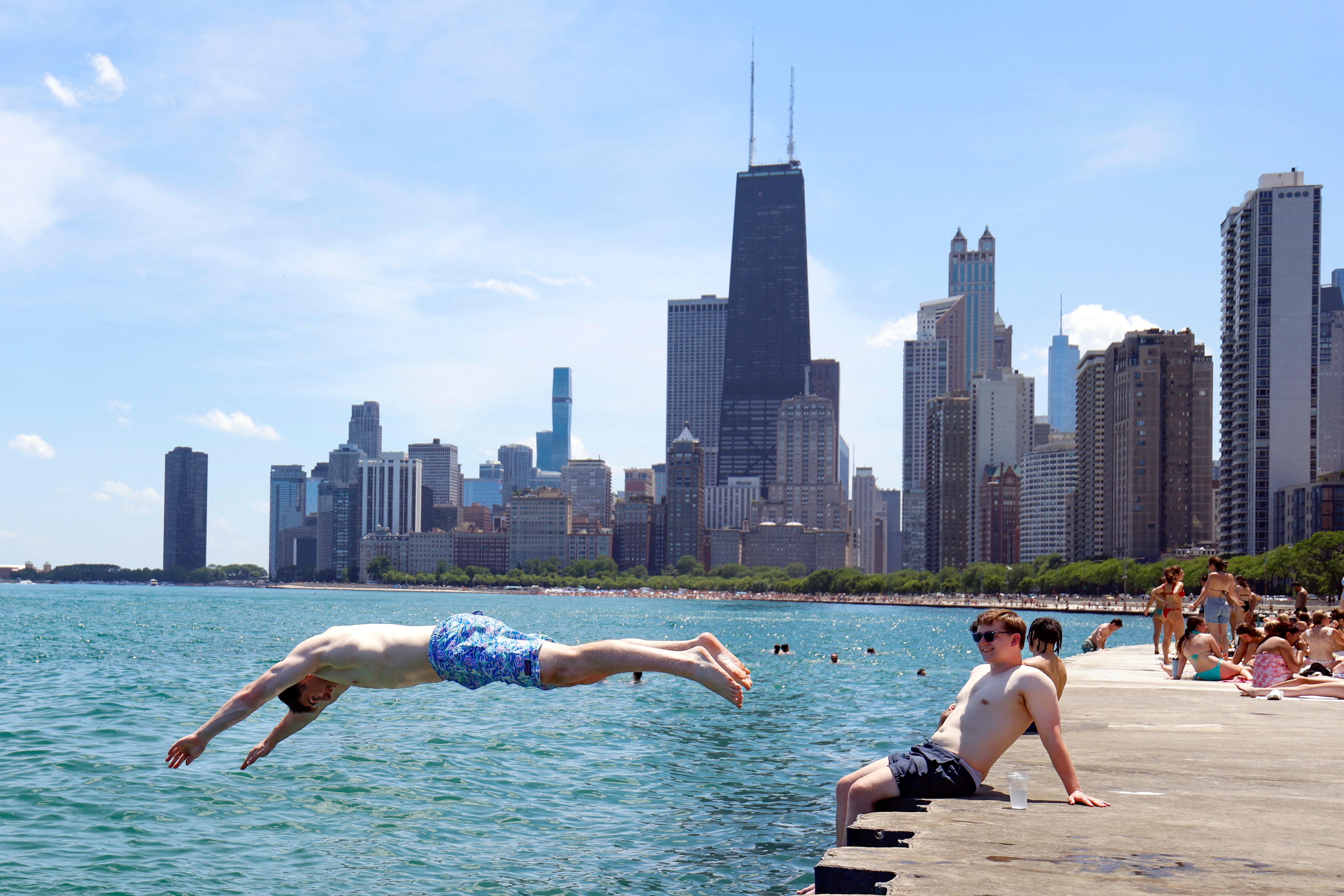 Beachgoers cool off at the North Avenue beach on Lake Michigan in Chicago