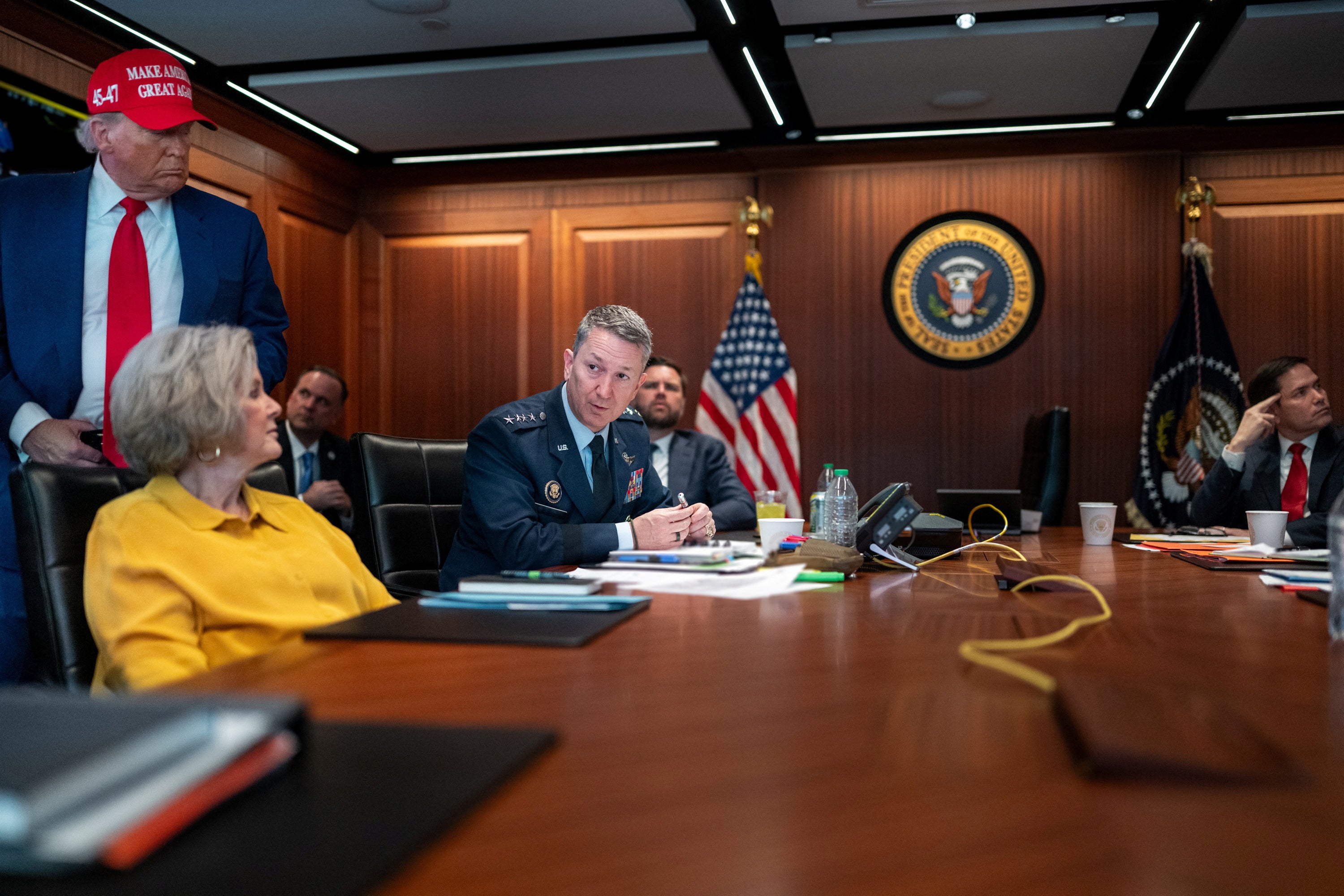 President Donald Trump in the White House situation room with Chief of Staff Susie Wiles and Chairman of the Joint Chiefs of Staff General Dan Caine
