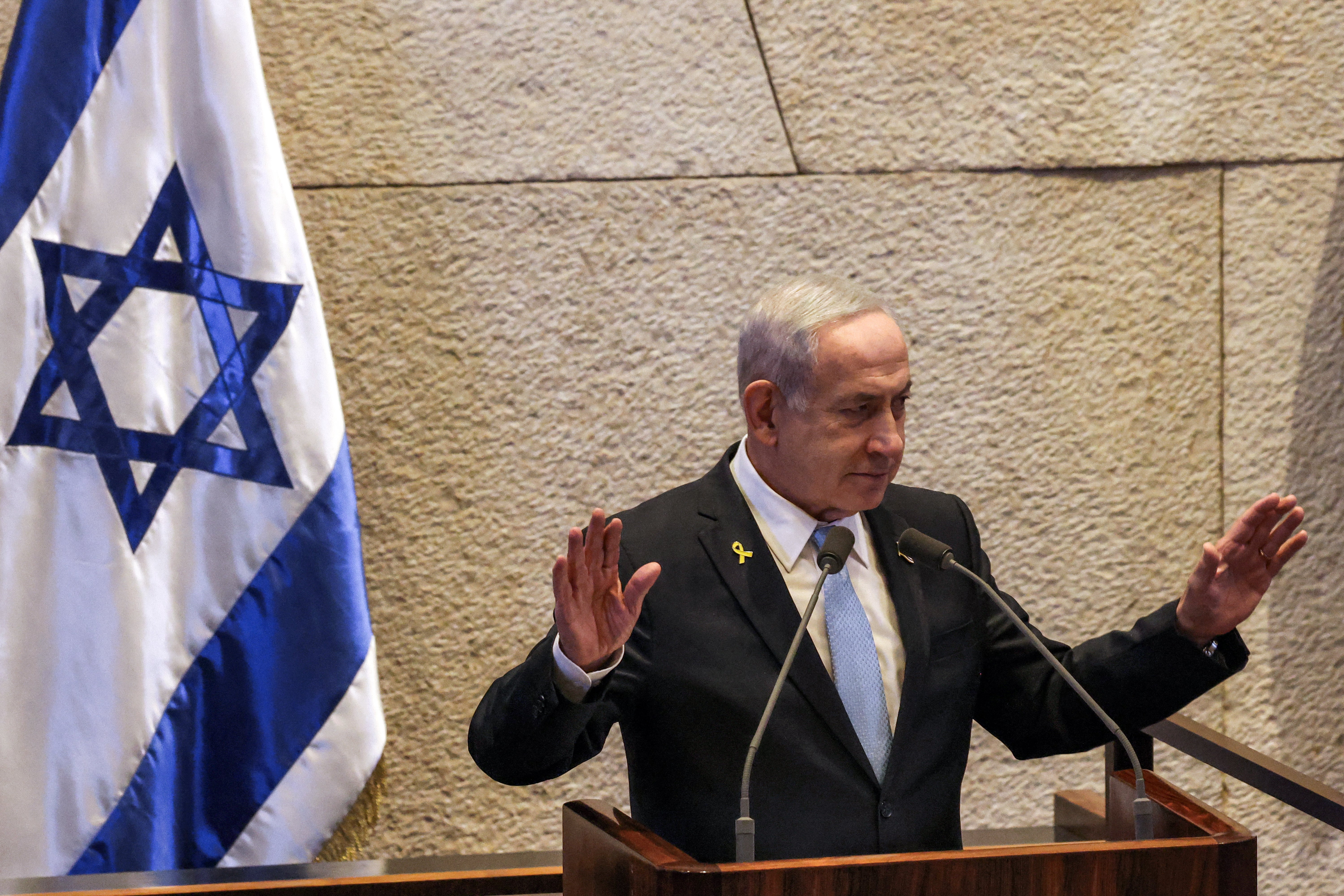 Israel's Prime Minister Benjamin Netanyahu gestures as he addresses the assembly during a session of the Israeli parliament (Knesset) at its headquarters in Jerusalem on June 11, 2025. (Photo by Menahem KAHANA / AFP) (Photo by MENAHEM KAHANA/AFP via Getty Images)