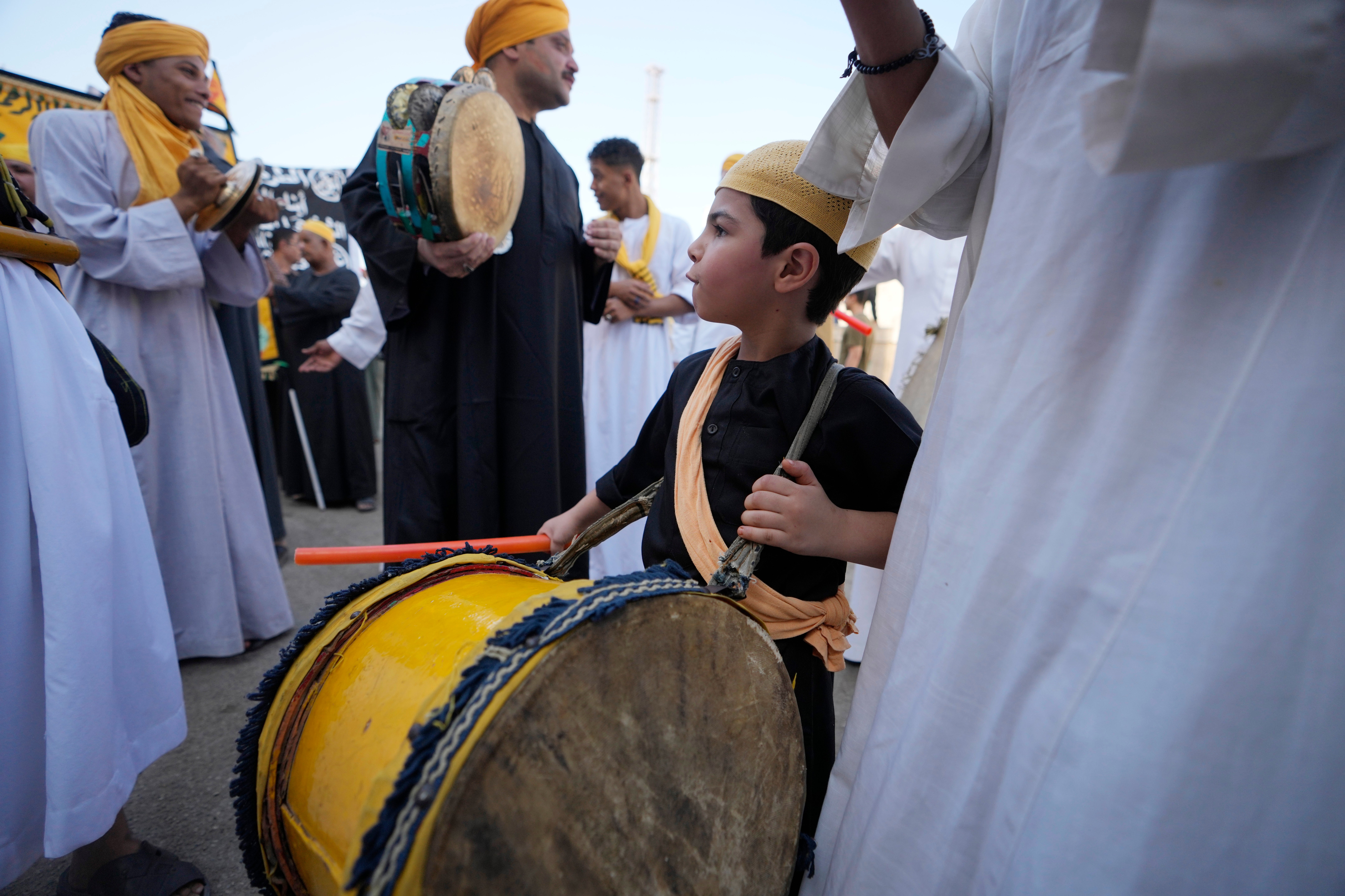 Sufi Muslims perform Zikr, or remembrance of God, as they sing Islamic songs during a parade to commemorate the beginning of the Islamic new year