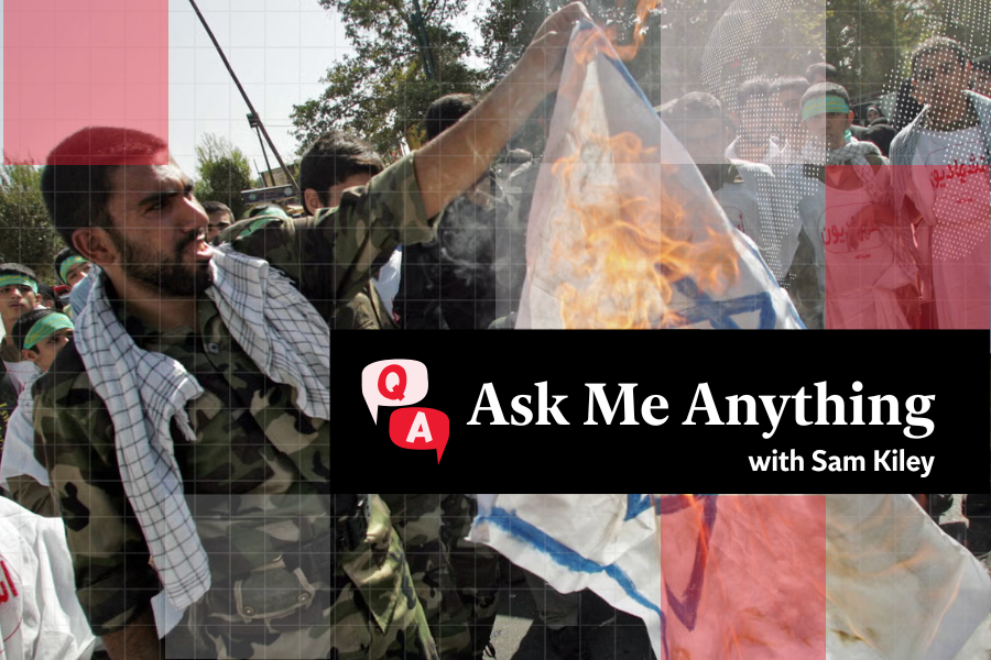 A member of Iran’s Revolutionary Guards burns an Israeli flag during a demonstration held in Tehran to mark Jerusalem (Al-Quds) Day