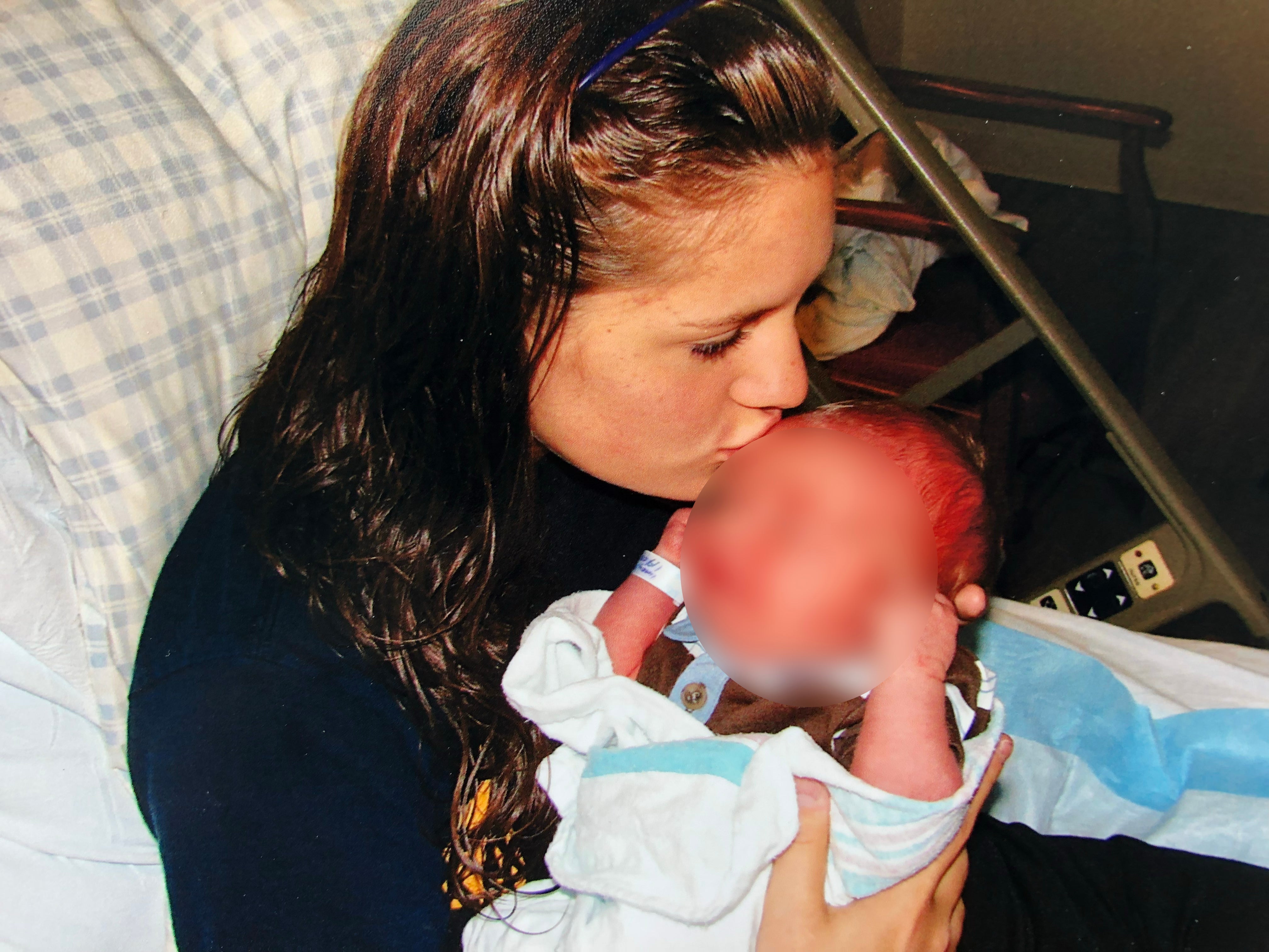 Abbi kisses her son goodbye before handing him over to his adoptive parents