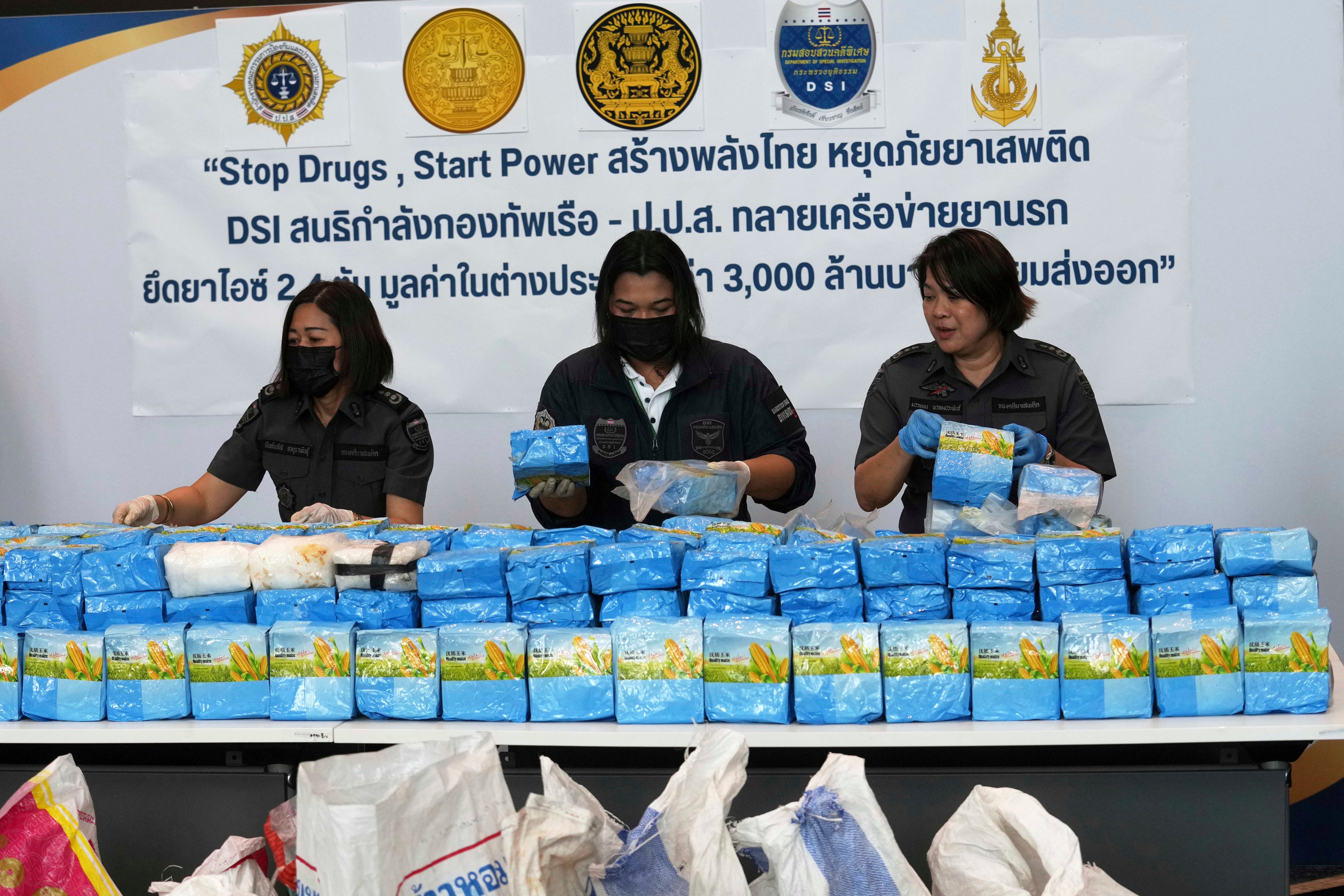 Department of Special Investigation officers arranged nearly 2.4 tons of crystal methamphetamine, which were disguised as bags of corn flour, during a news conference in Bangkok, Thailand