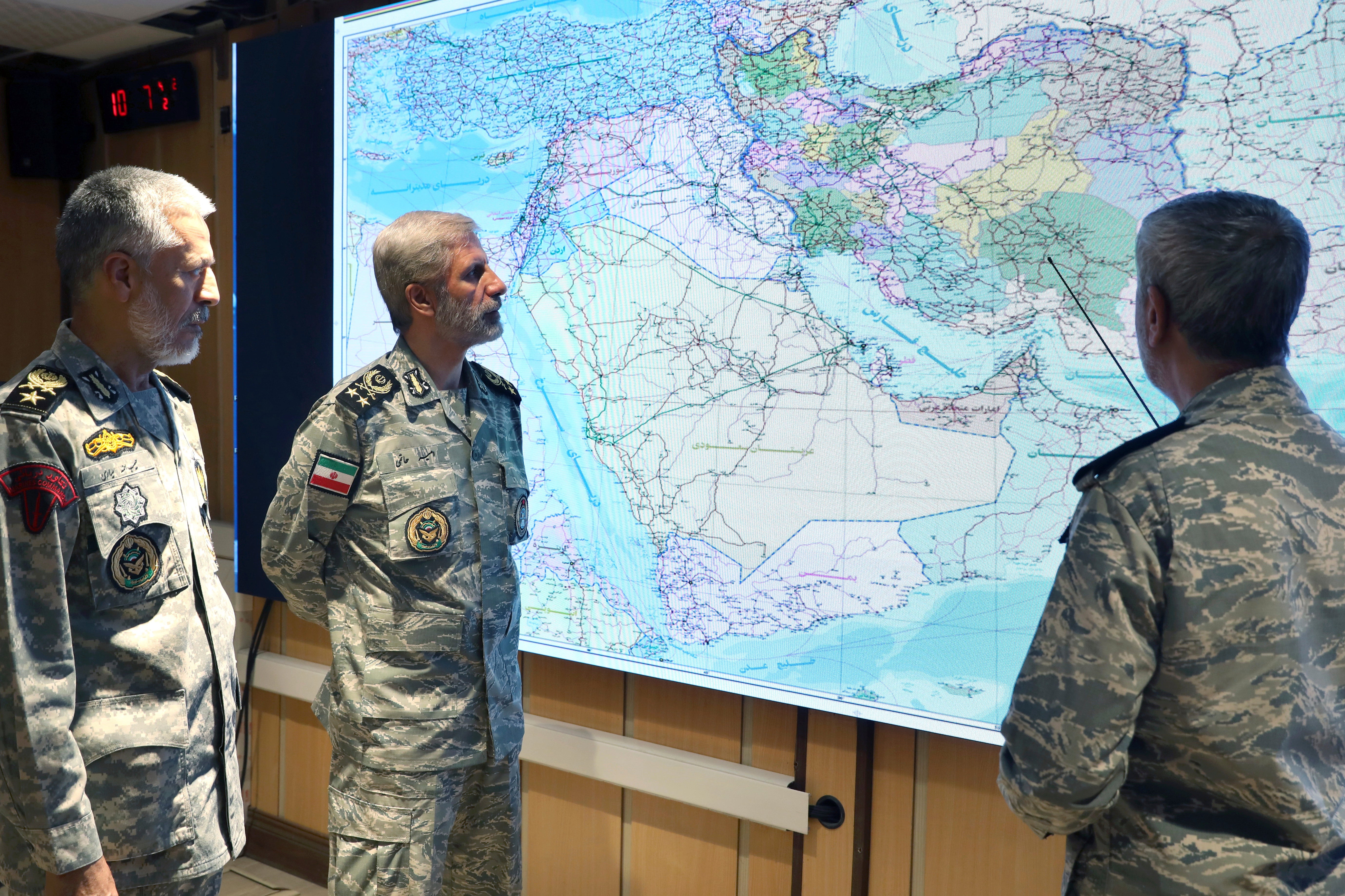 Iran's army commander-in-chief Gen. Amir Hatami, center, Admiral Mahmoud Mousavi, right, and Admiral Habibollah Sayyari attend a meeting in Zolfaghar central headquarters, Iran