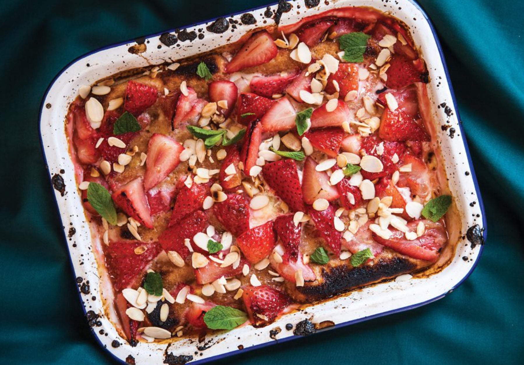 A quick twist on a classic trifle – sponge fingers, caramelised strawberries and a zing of lemon under the grill