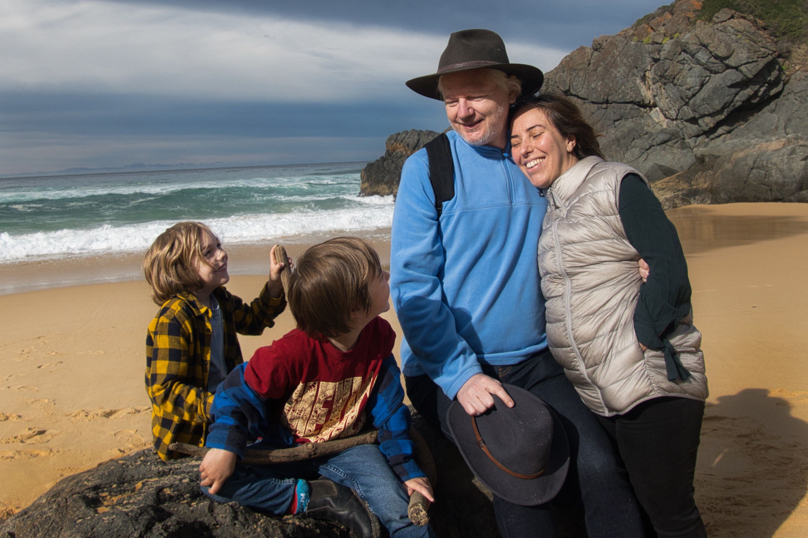 Julian Assange with his wife Stella and children, Gabriel and Max on a beach (Assange family/PA)