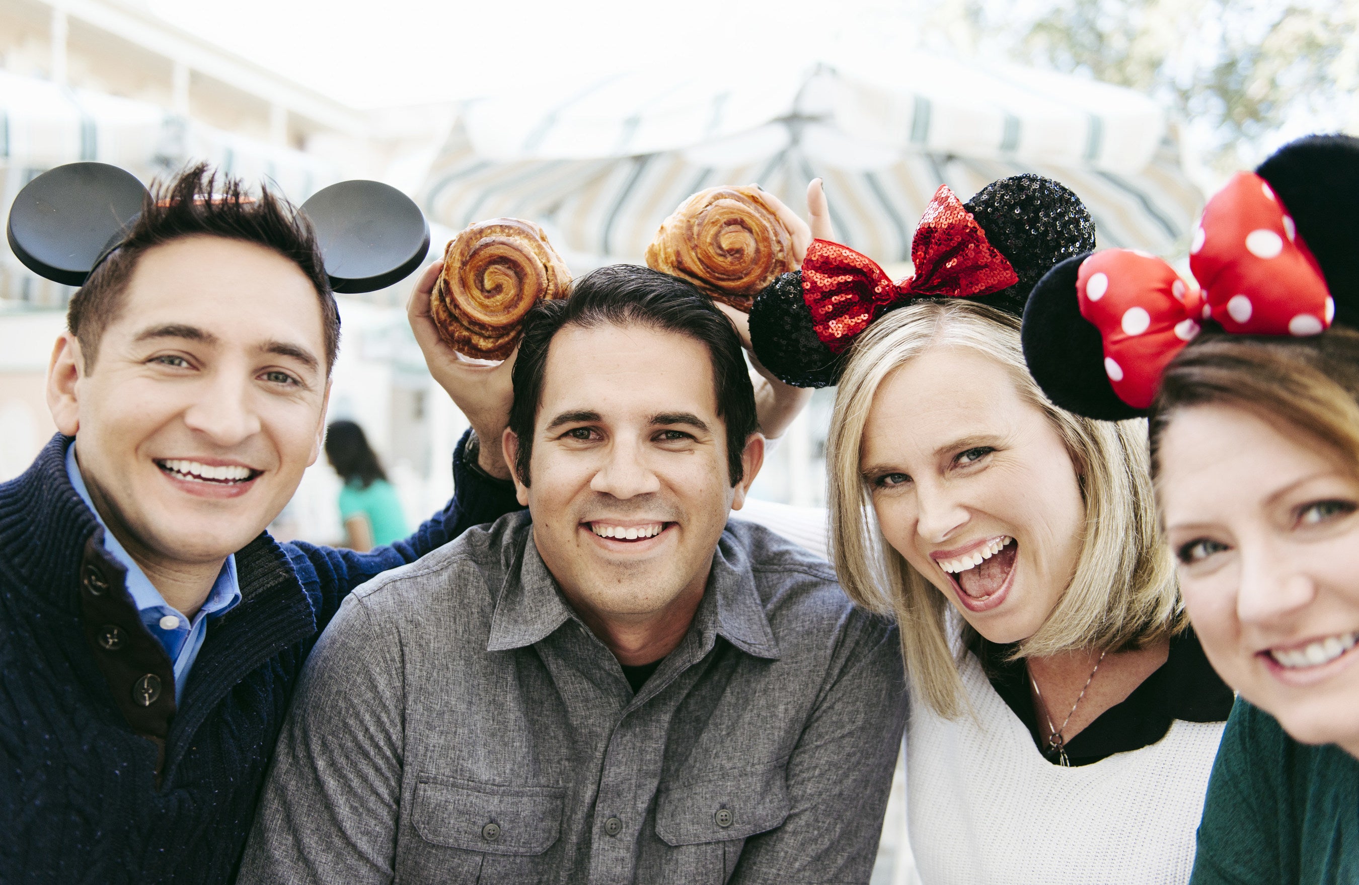 Adults in Disney merchandise pose for a photo (file photo)