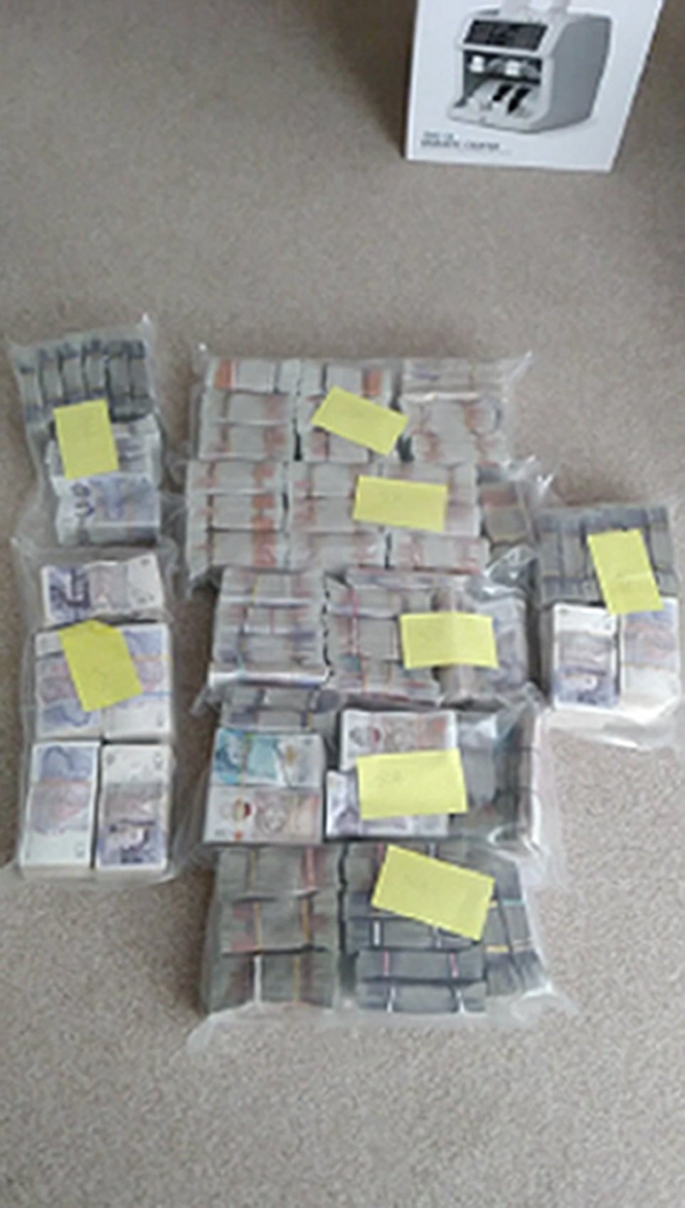 Bundles of banknotes seized by police as part of an investigation into drugs kingpins James Harding, 34, and his "loyal right-hand man" Jayes Kharouti, 39