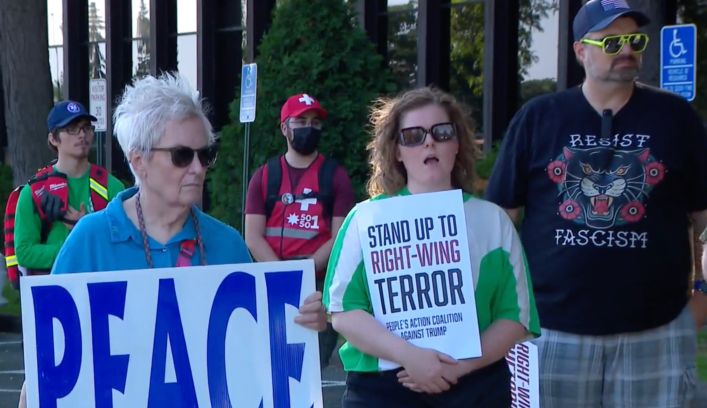 Protesters denounce Republican political rhetoric oustide the party's local headquarters in Edina, Minnesota, on Monday June 23 2025