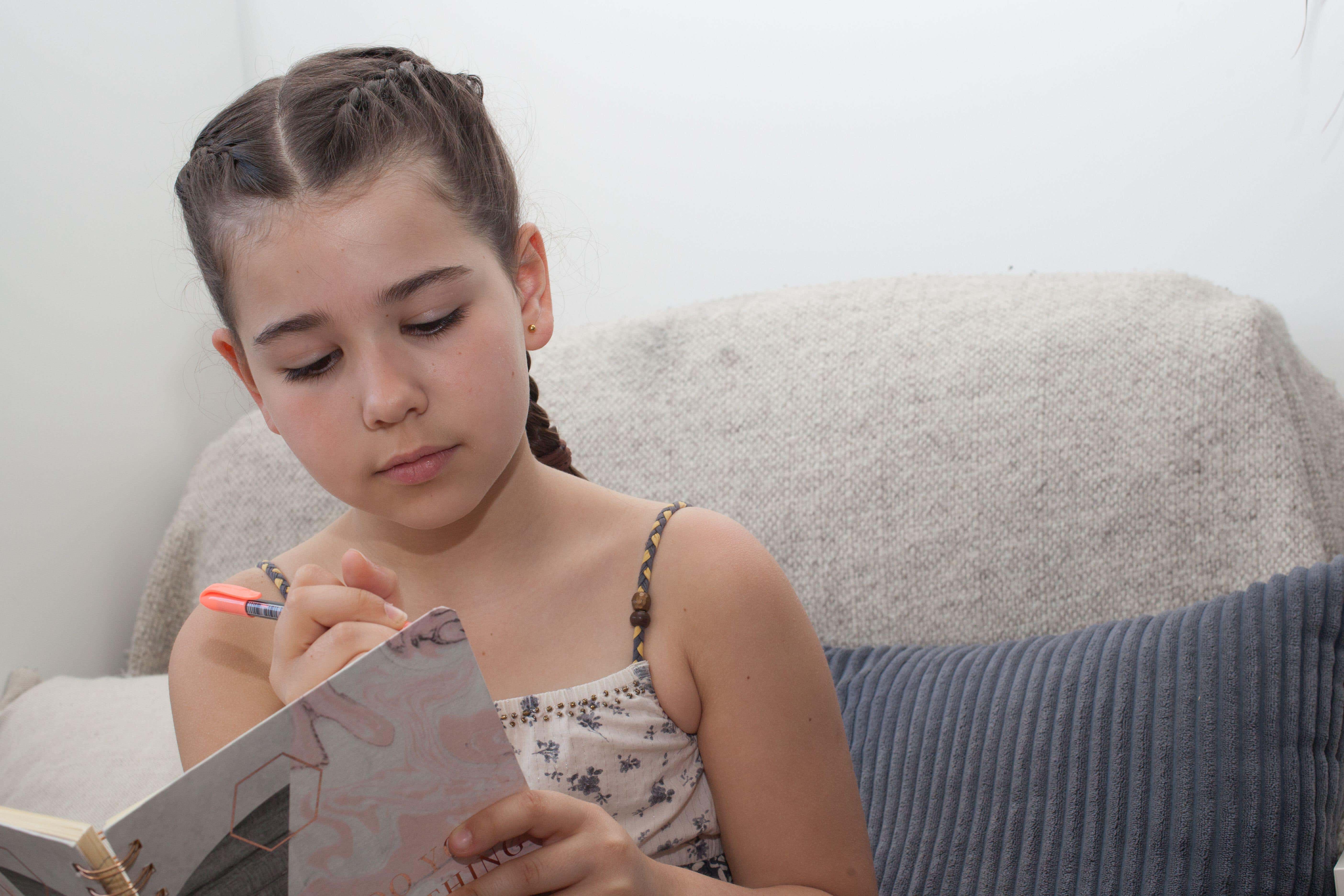 Only one in 10 children said they write daily in their free time (Alamy/PA)