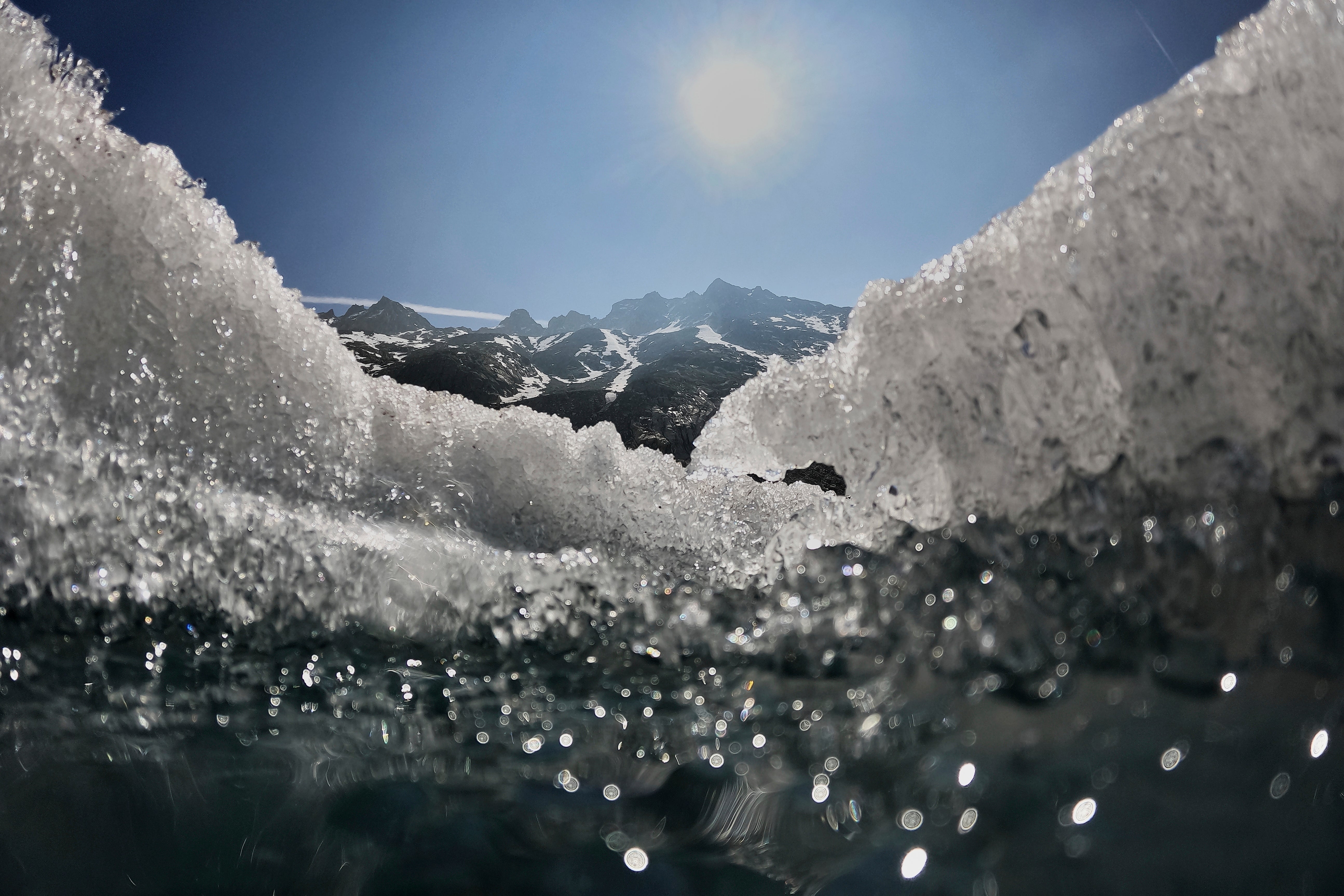The sun shines over the melting Rhone Glacier near Goms, Switzerland, June 10, 2025. (AP Photo/Matthias Schrader)