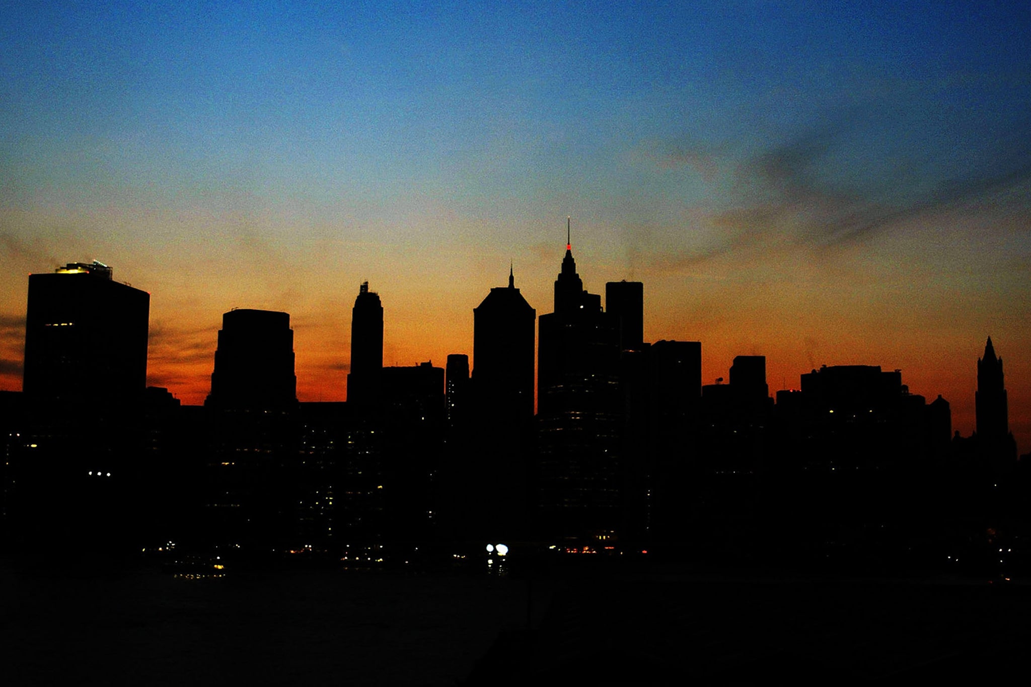 The sun sets over the Manhattan skyline during a major power cut in 2003
