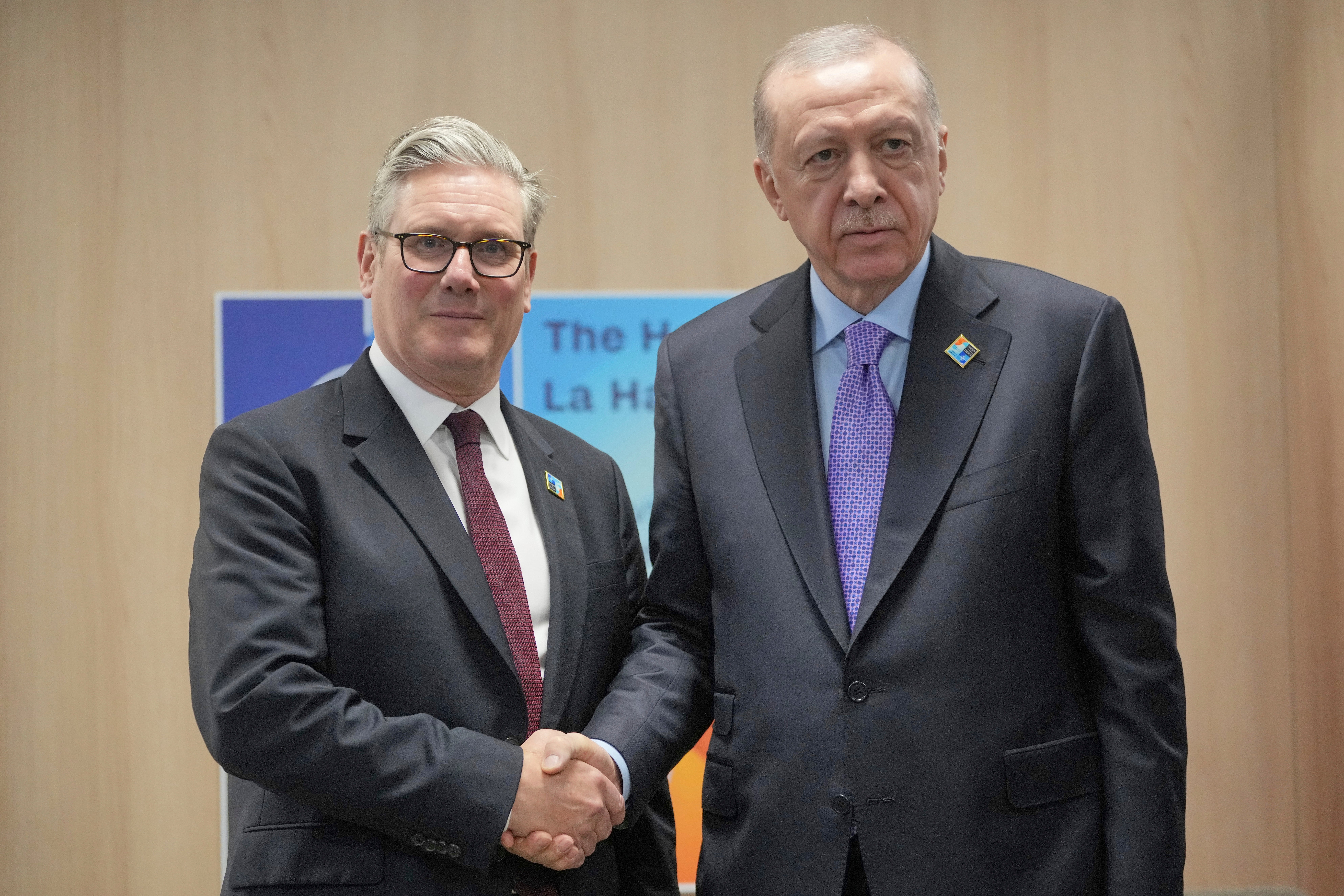 Turkey's President Recep Tayyip Erdogan, right, shakes hands with Britain's Prime Minister Keir Starmer during a bilateral meeting at the NATO summit in The Hague, Netherlands, Wednesday, June 25, 2025