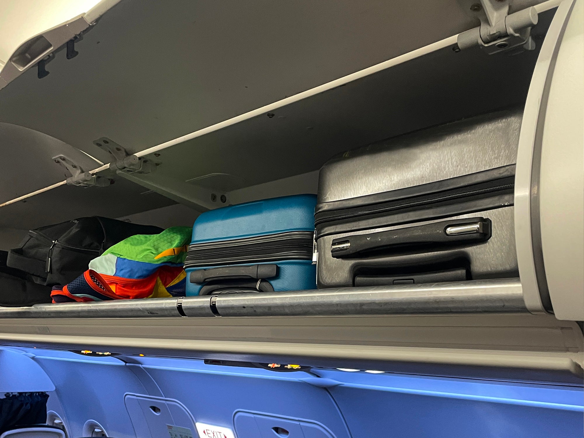 Place bags in overhead bins with the wheels or handles facing out, says a travel consultant