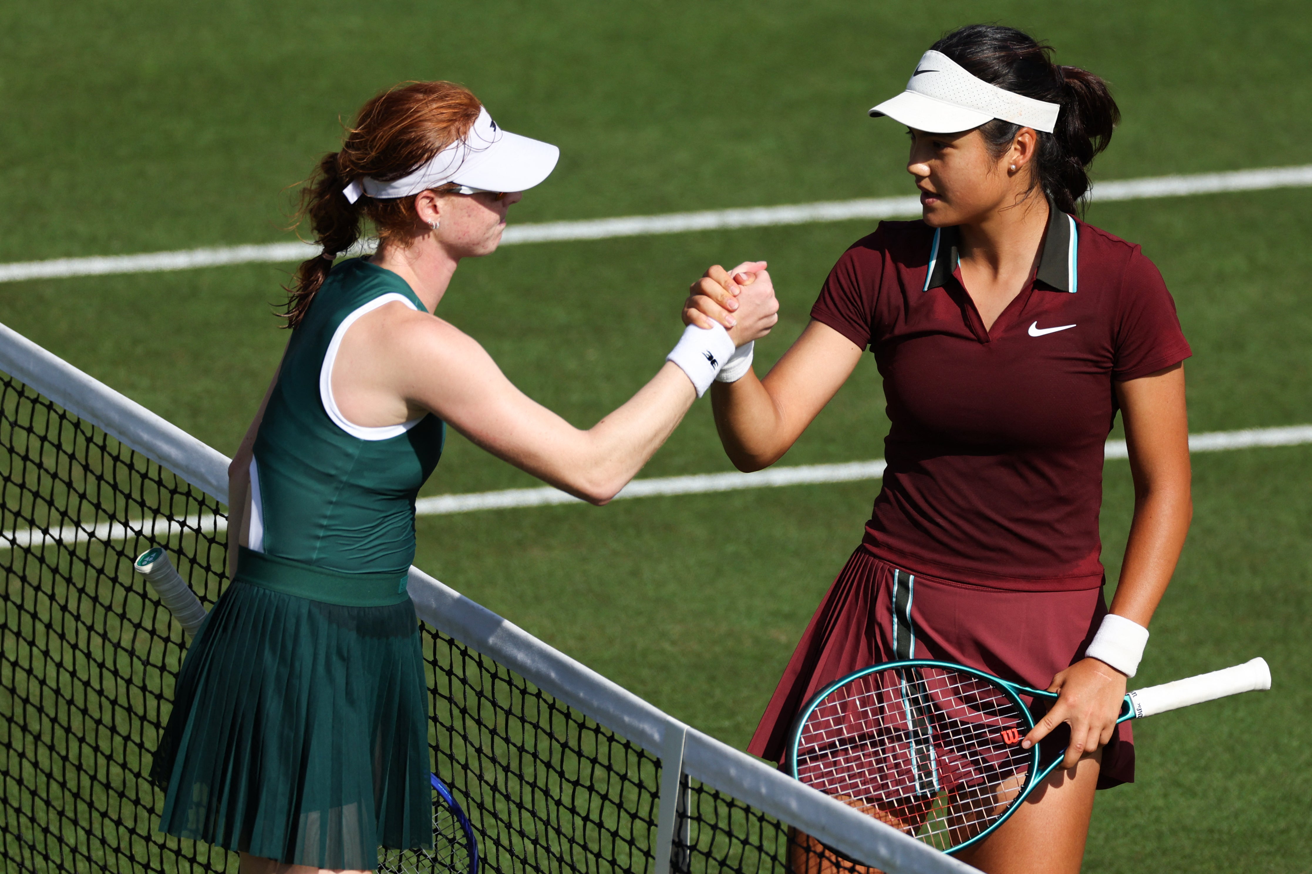 Joint (left) shakes hands with Raducanu after sealing victory