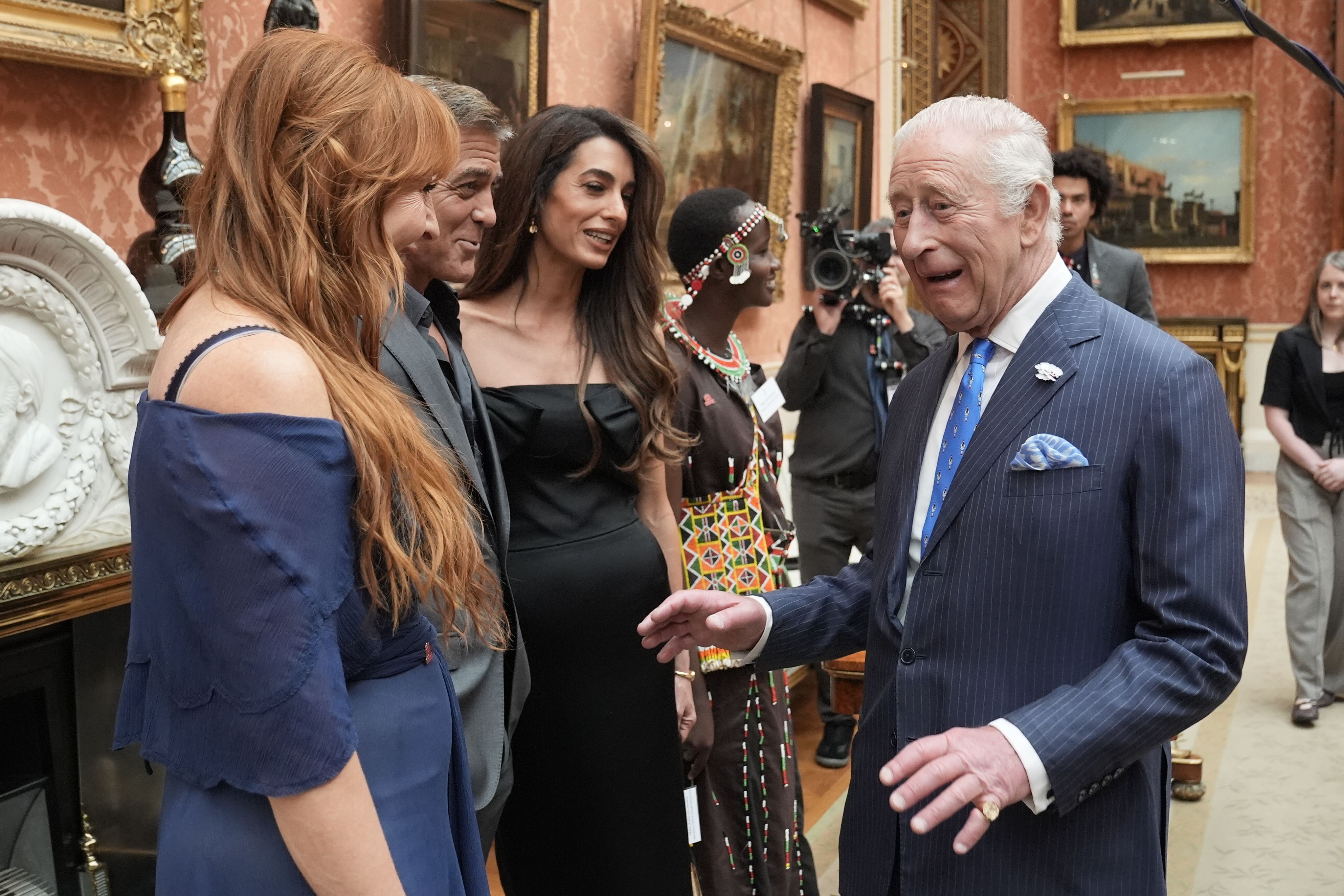 The King speaks with (left to right) Charlotte Tilbury, and George and Amal Clooney during a reception for the winners of the King’s Trust Awards 2025 at Buckingham Palace, London (Stefan Rousseau/PA)
