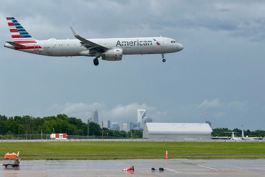 Passengers and local observers reported seeing smoke and flames on an American Airlines plane departing from Las Vegas for Charlotte, North Carolina, on Wednesday morning.