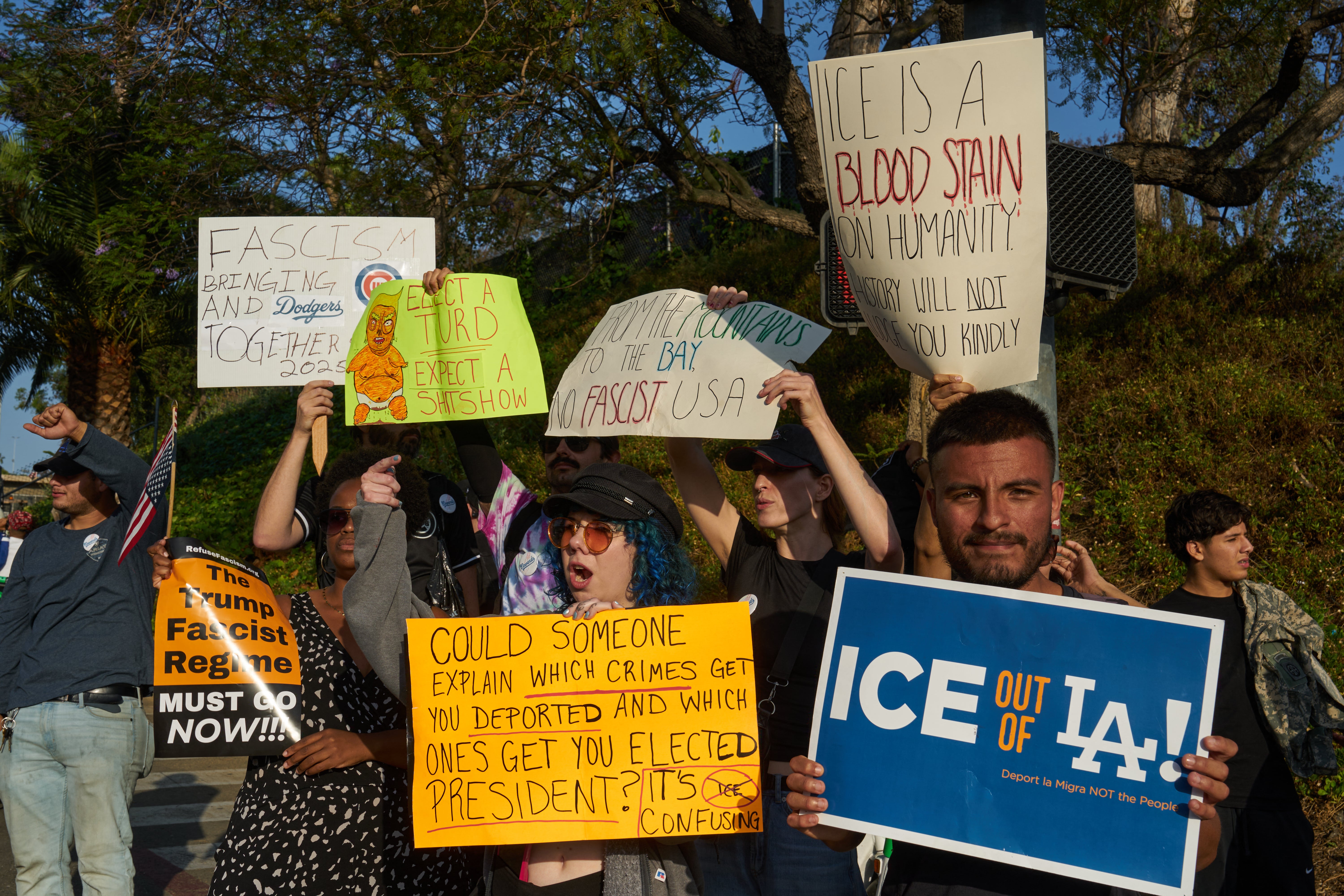 Protesters hold signs at an anti-ICE rally in Los Angeles. New data suggests ICE has arrested six percent of known undocumented immigrants convicted of murder