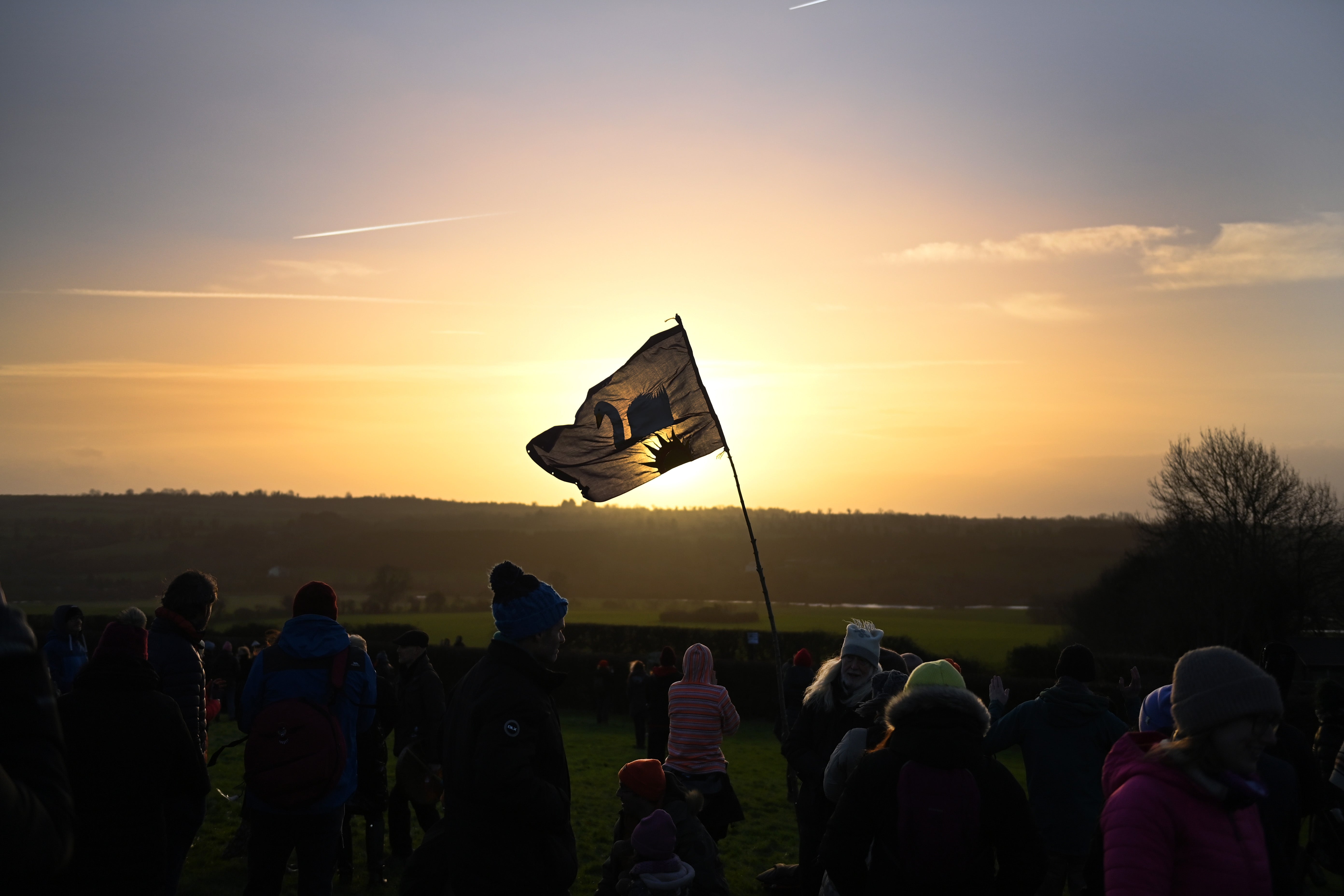 Sun worshippers celebrate Winter Solstice as the sun rises over Newgrange Neolithic Monument