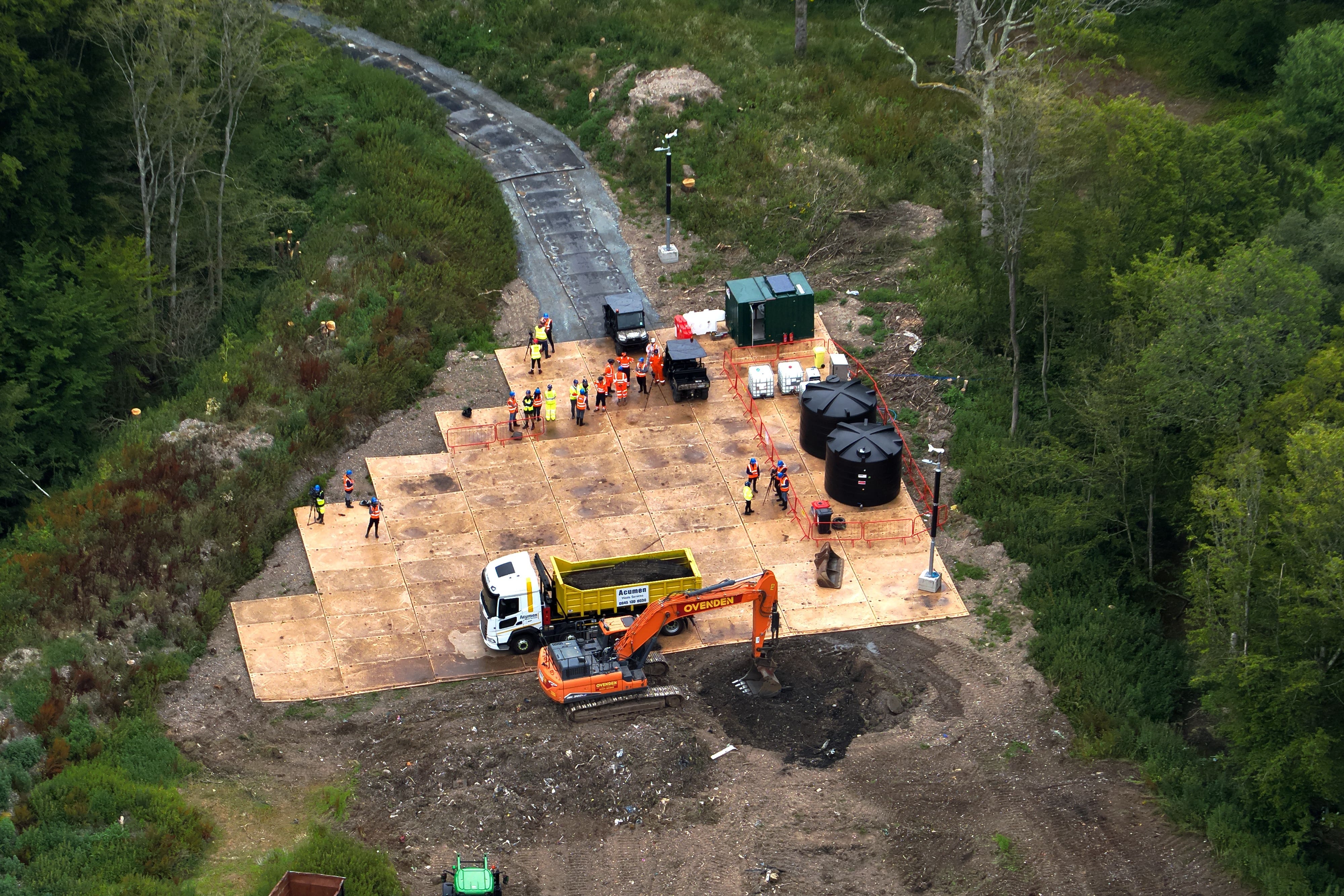 Contractors prepare to remove thousands of tonnes of illegally dumped waste within the ancient woodland Hoads Wood in Ashford, Kent (Environment Agency/PA)