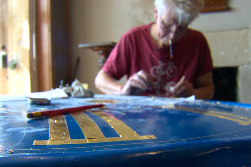 Symon Boyd works on the restoration of the Montacute clock (Grace productions/PA)