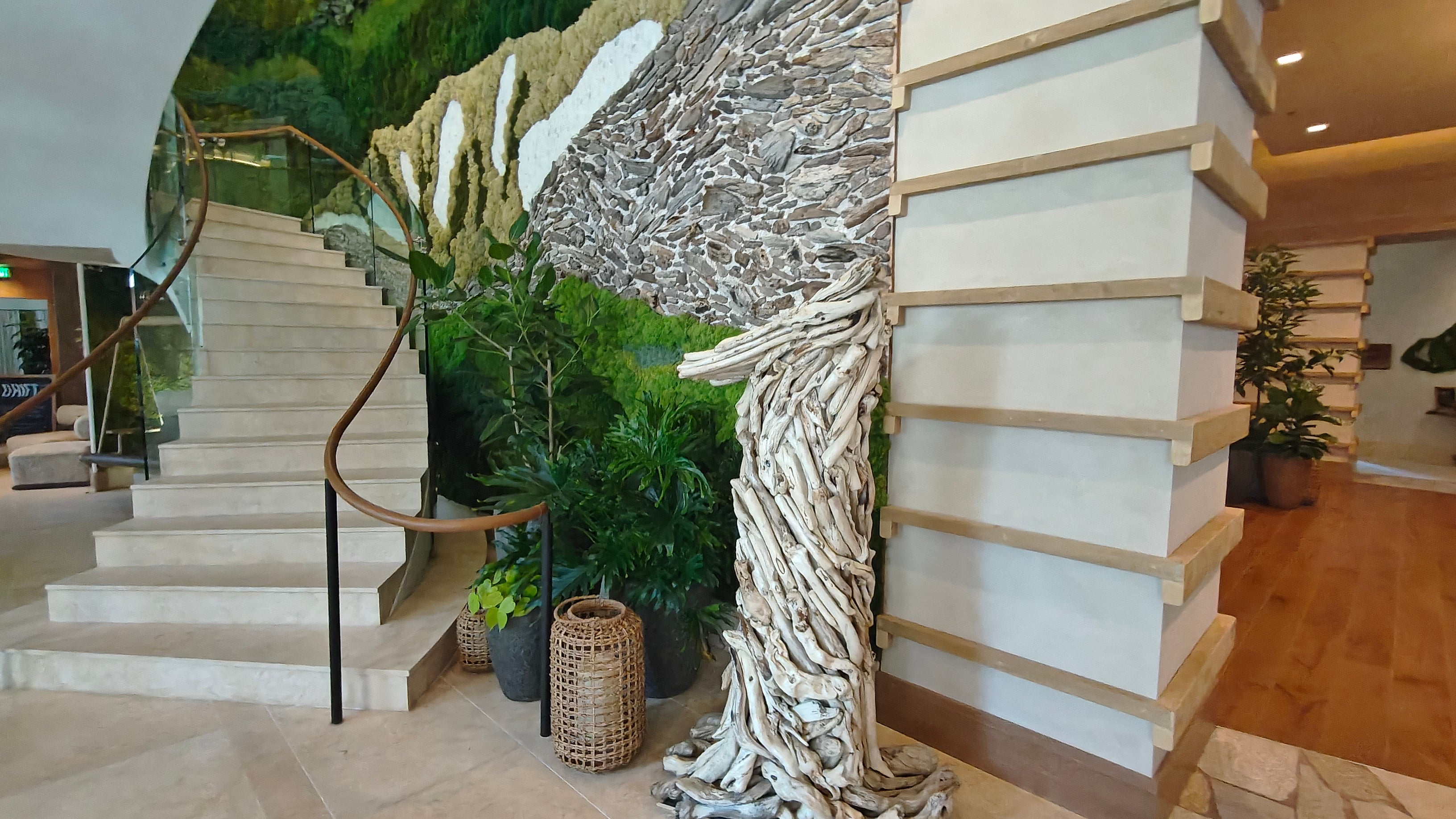 Guests are welcomed into the lobby by a living wall of vegetation