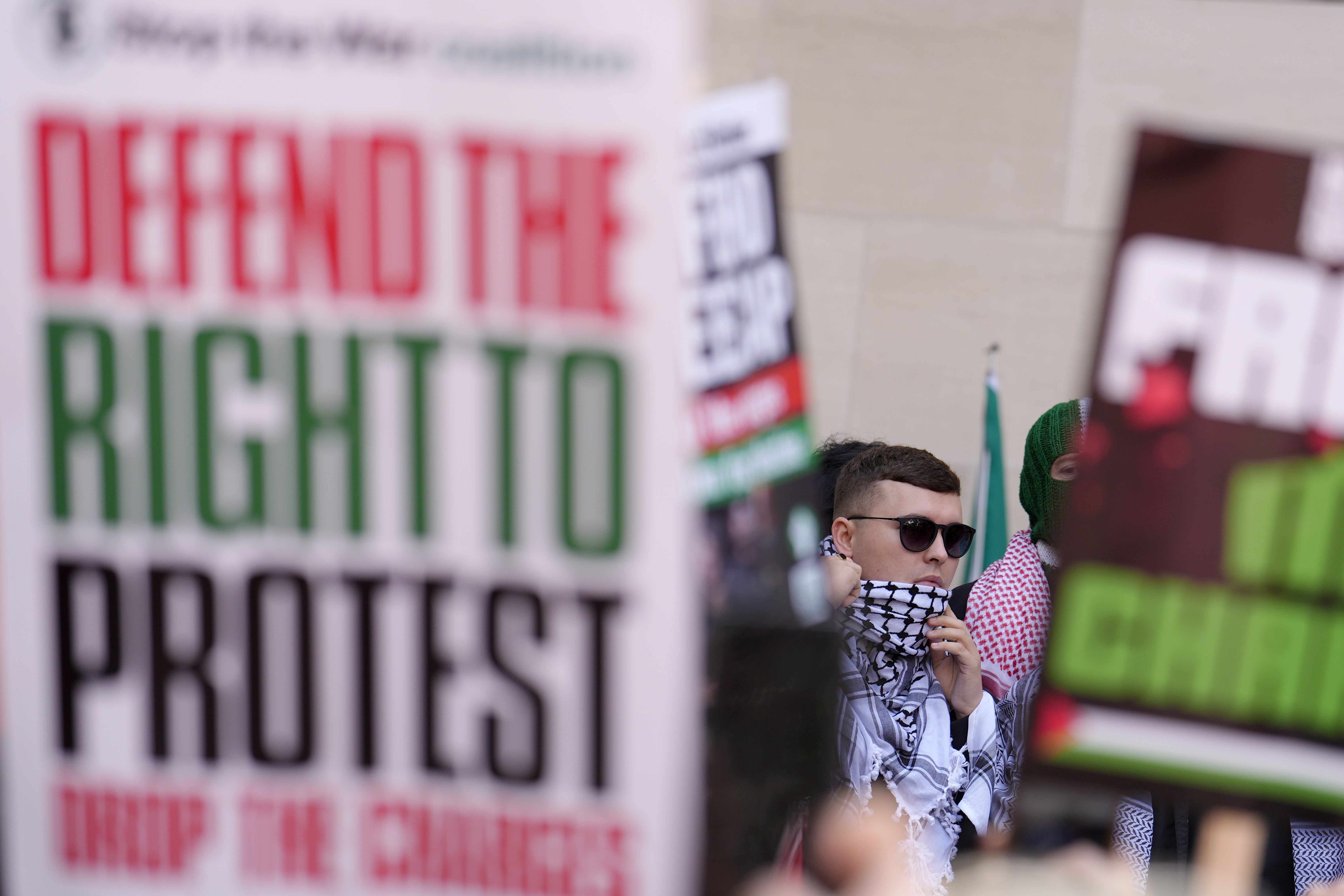 The investigation was separate from the ongoing case against band member Liam Óg Ó hAnnaidh, pictured leaving Westminster Magistrates’ Court in London through a crowd of supporters after he appeared charged with a terrorism offence in June. (Jordan Pettitt/PA)