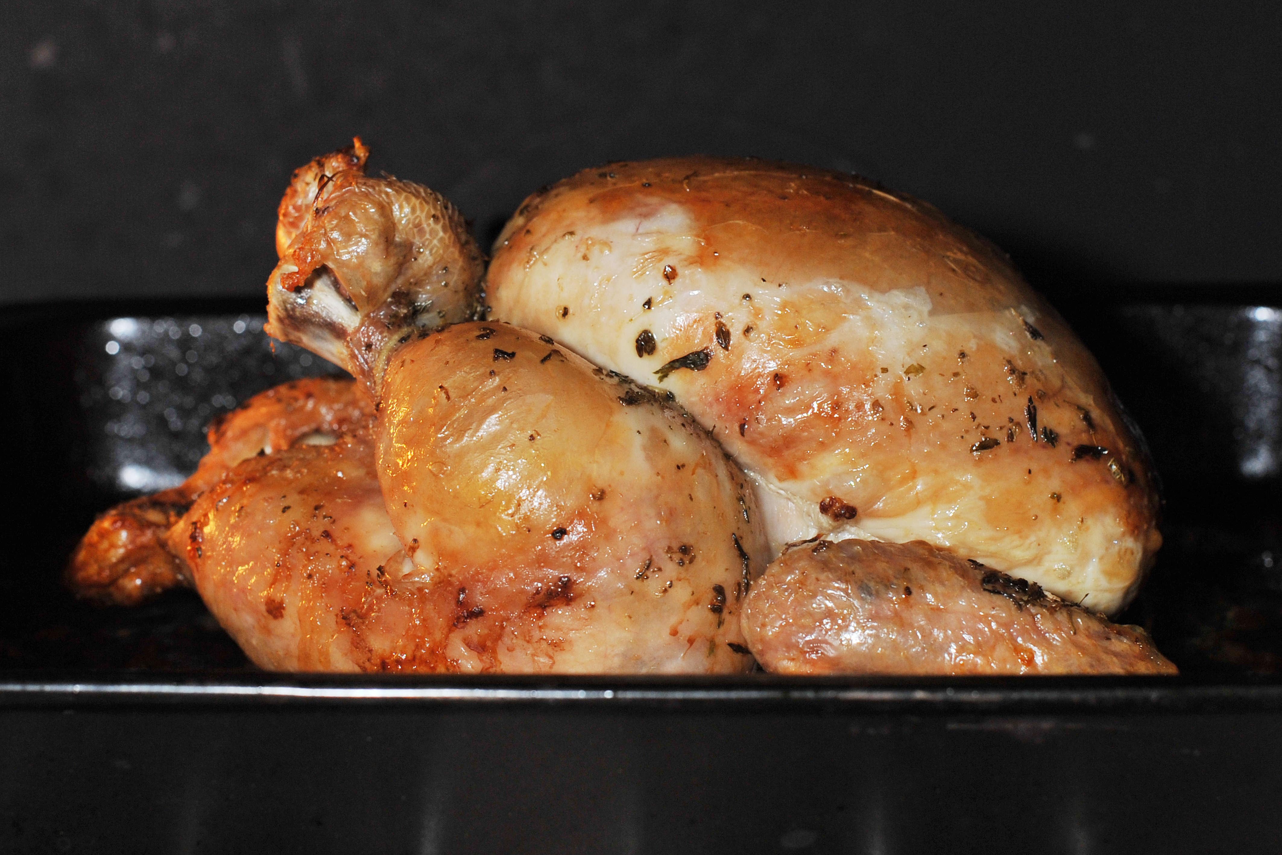 A chicken being roasted in a household oven (PA)