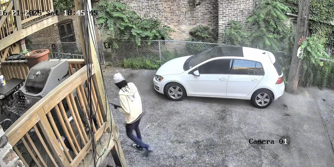 In another surveillance video, the alleged perpetrator was seen holding a clipboard outside the property