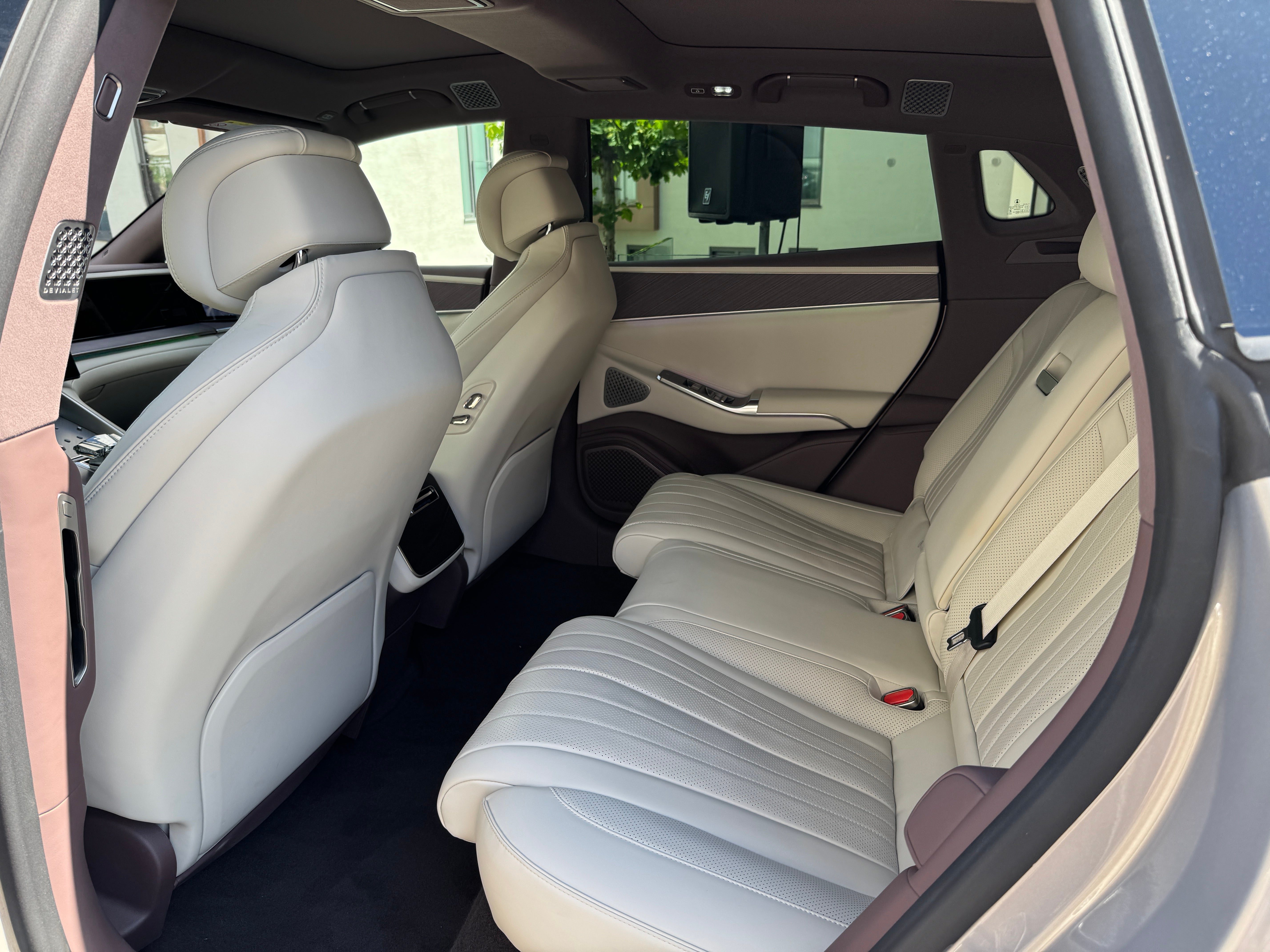 Rear seat space is good in the Denza Z9 GT and there's a fridge back there, too