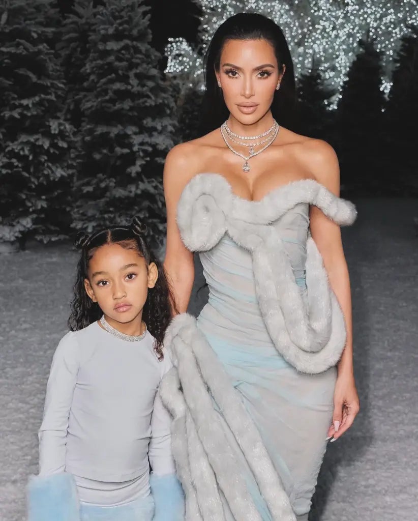 Kim Kardashian twinned with her daughter, Chicago, in off-white and light blue dresses for Christmas Eve in 2023