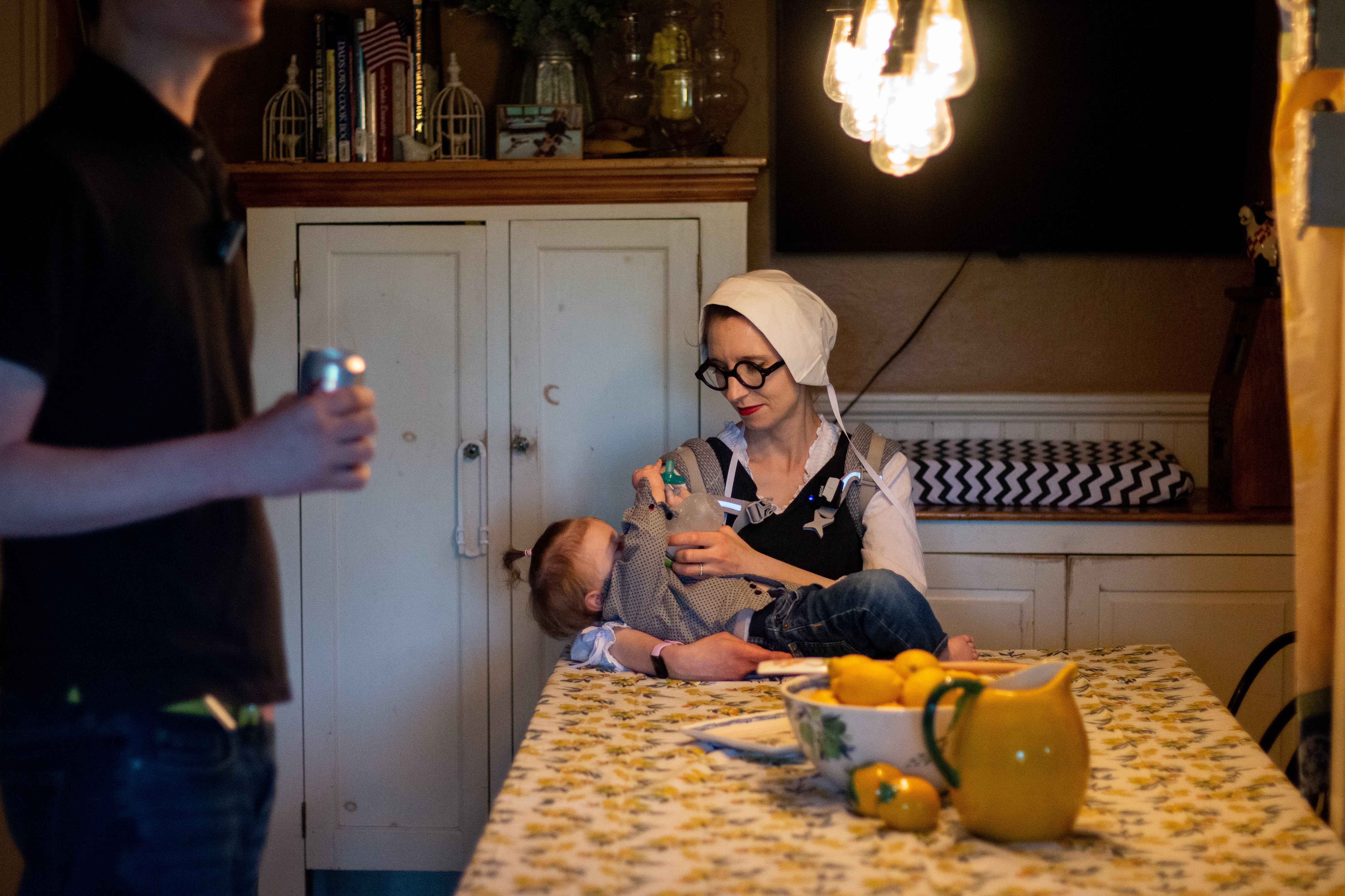 Malcolm makes his way through a pack of Coors Light while Simone feeds and changes the baby