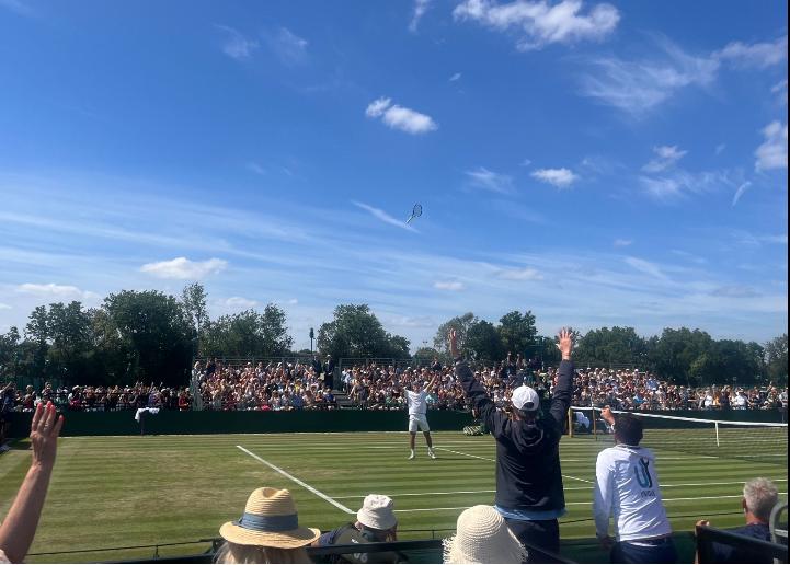 Tarvet celebrates his four-set win in Roehampton by throwing his racket into the air
