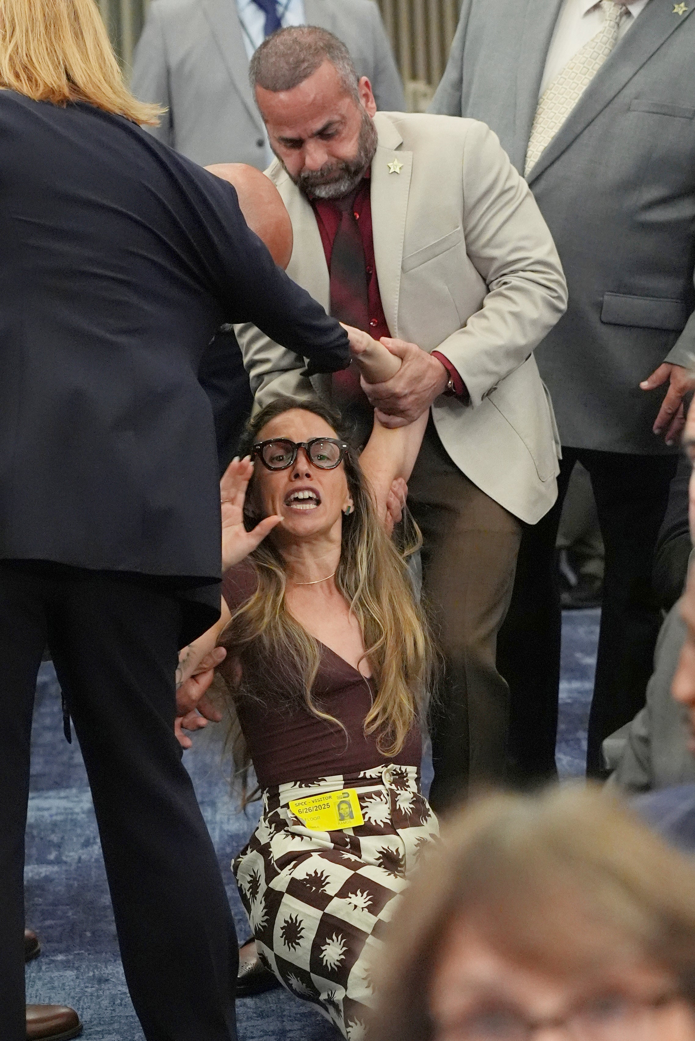 Video footage and pictures showed the woman, later identified as 36-year-old Camila Ramos, being manhandled by County Sheriff’s deputies and falling to the floor