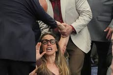 Shocking scenes as woman dragged out of meeting for trying to speak during hearing on ICE rules