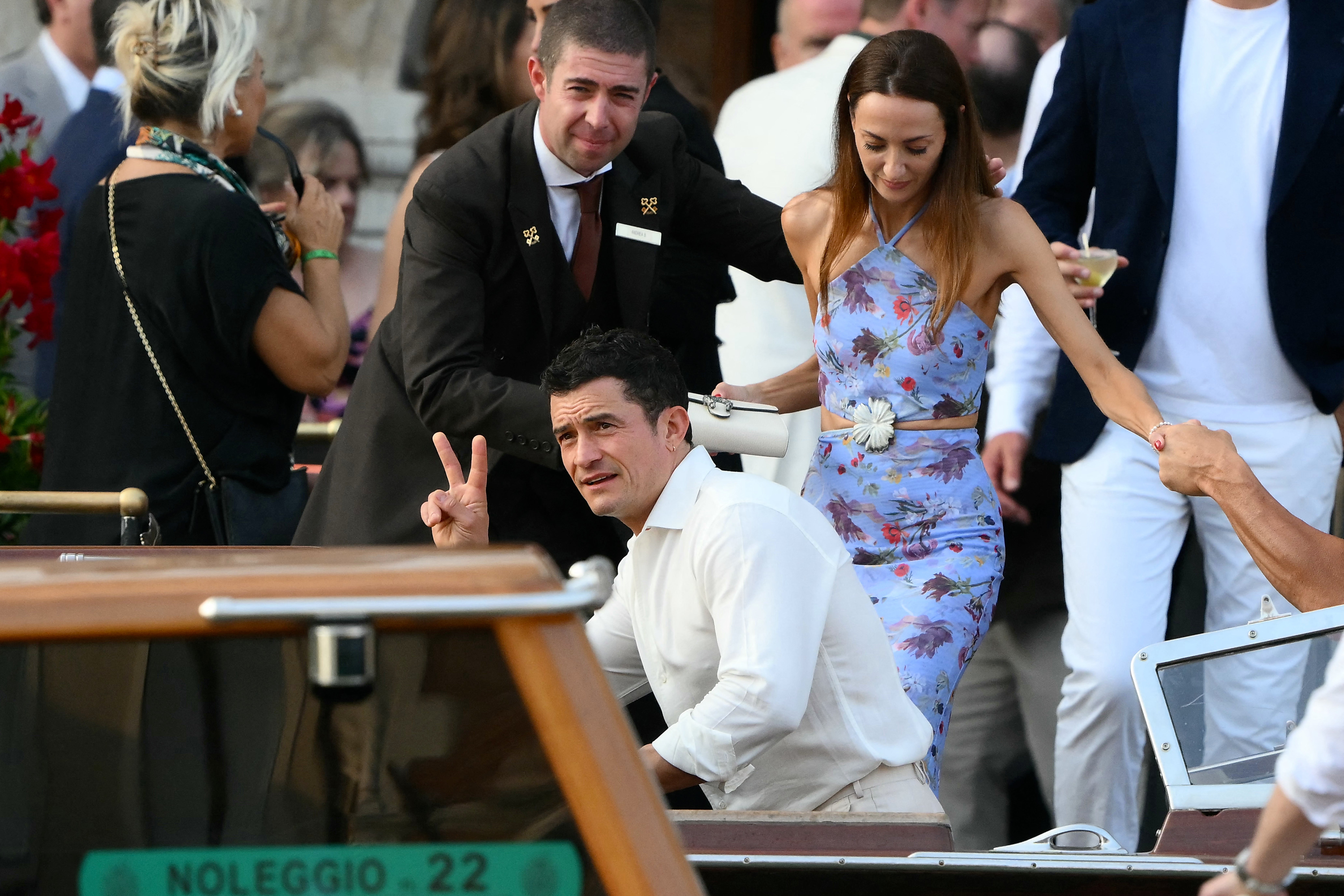 Orlando Bloom gets into a water taxi in Venice