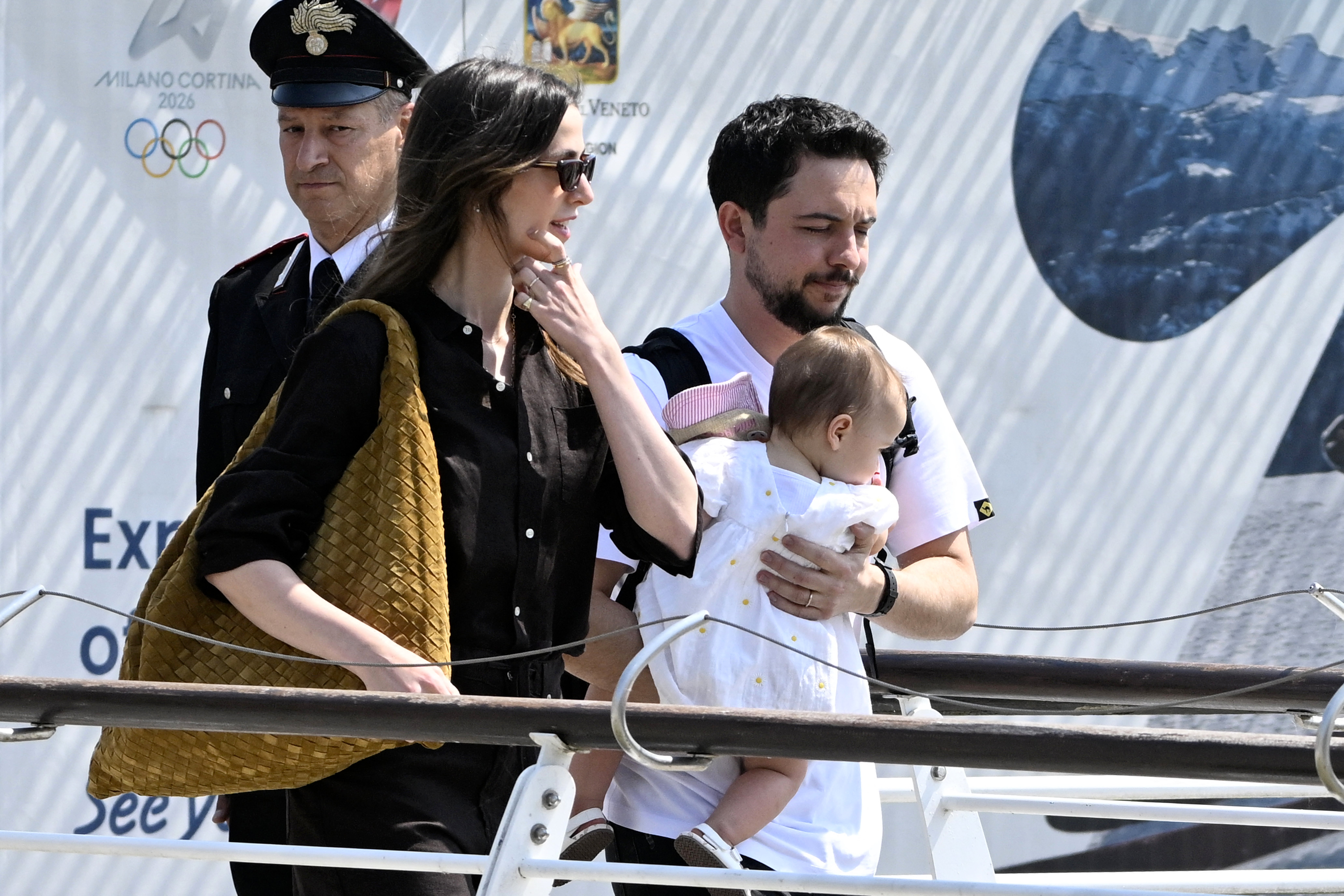 Jordan's Princess Rajwa (L), Crown Prince of Jordan, Hussein bin Abdullah and their daughter Iman Bint Hussein board a taxi boat after landing at Venice Marco Polo airport