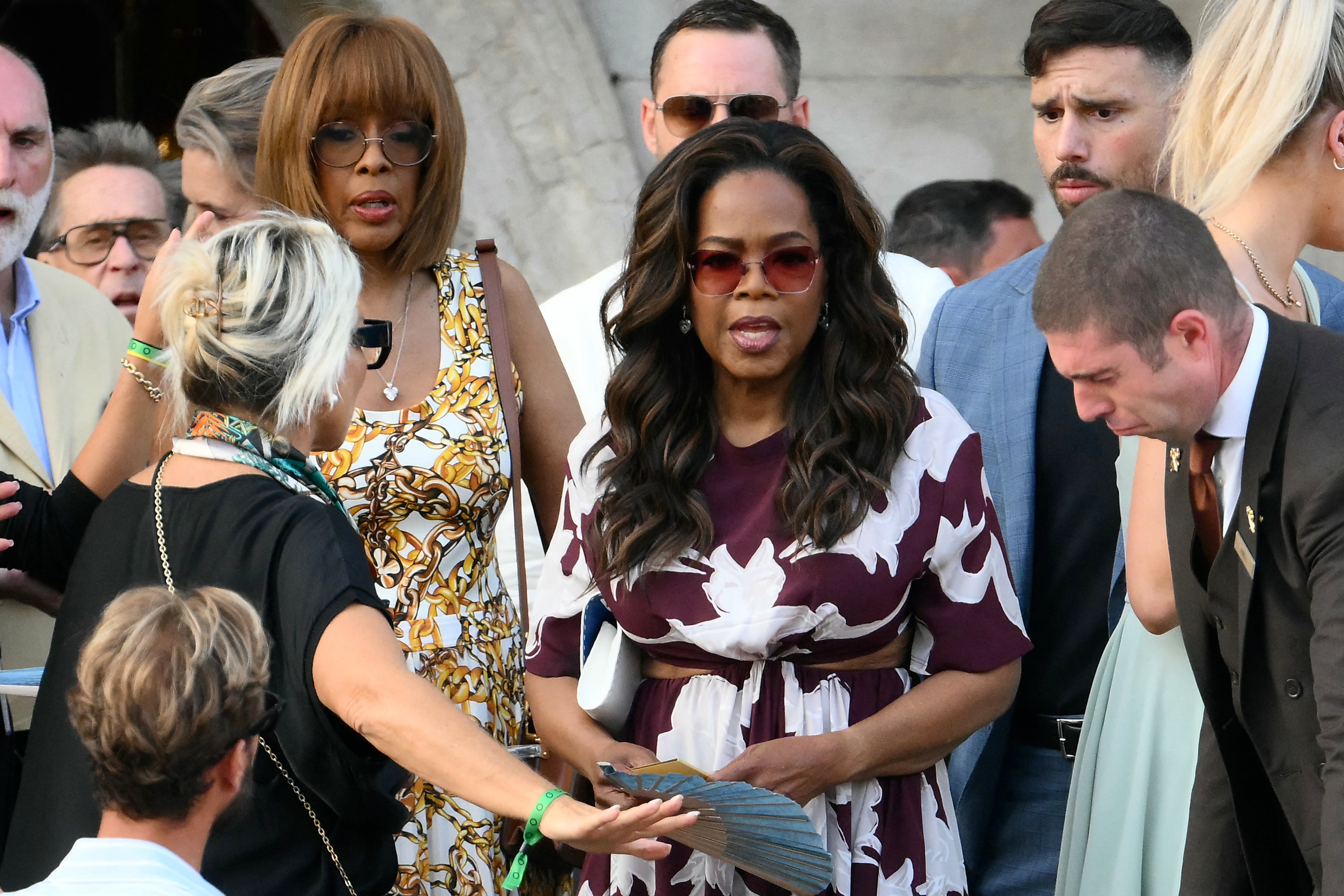 Gayle King (left) and Oprah Winfrey (right) getting on a water taxi to leave the Gritti Palace Hotel