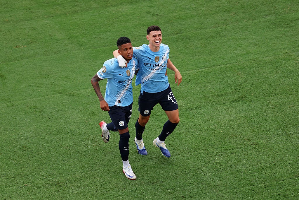 Phil Foden #47 of Manchester City celebrates with Savinho #26 of Manchester City after scoring his team's fourth goal during the FIFA Club World Cup 2025 group G match between Juventus FC and Manchester City FC at Camping World Stadium on June 26, 2025 in Orlando, Florida