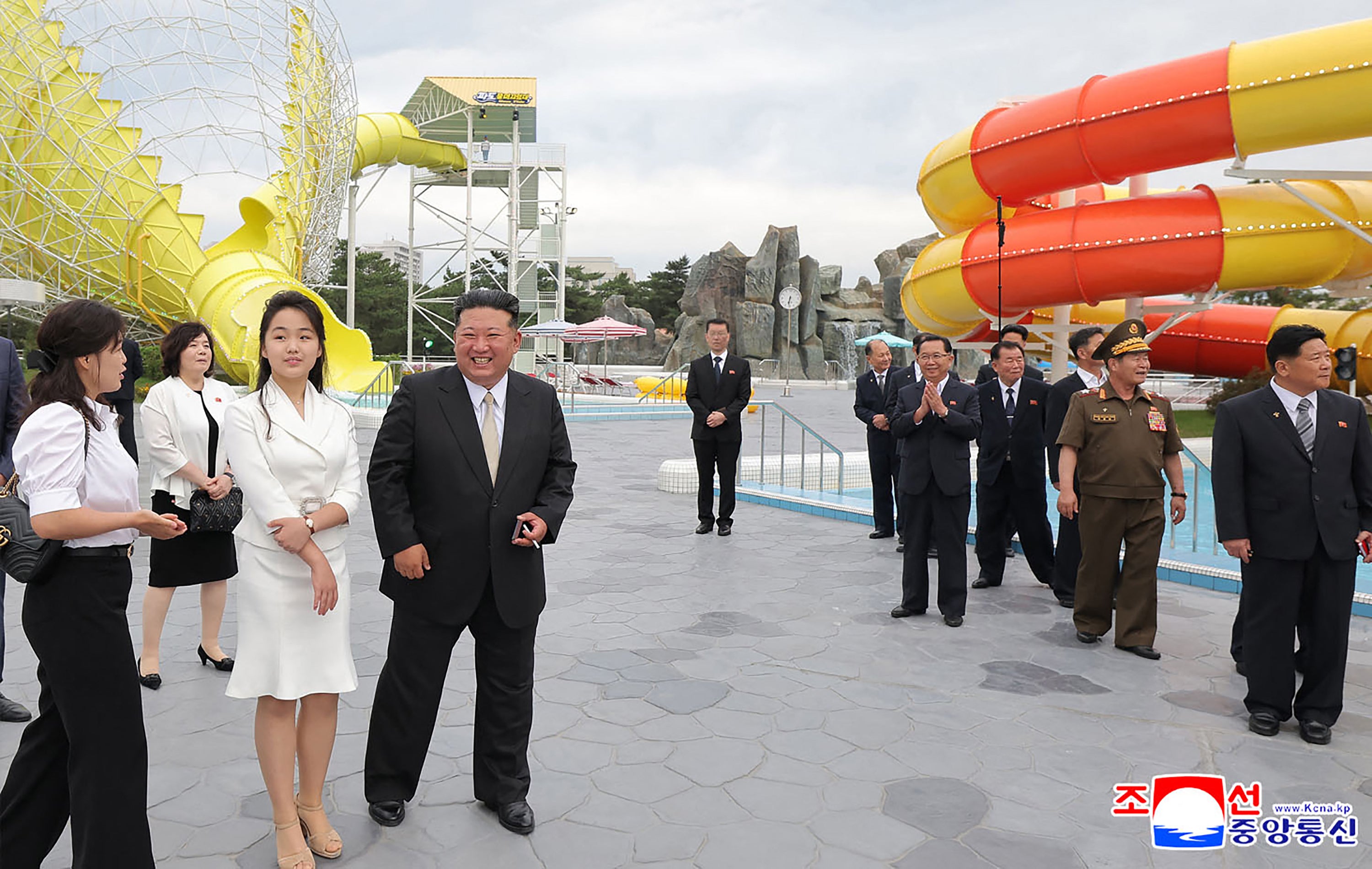 The North Korean leader smiles with his daughter as he is shown around the Wonsan-Kalma water park