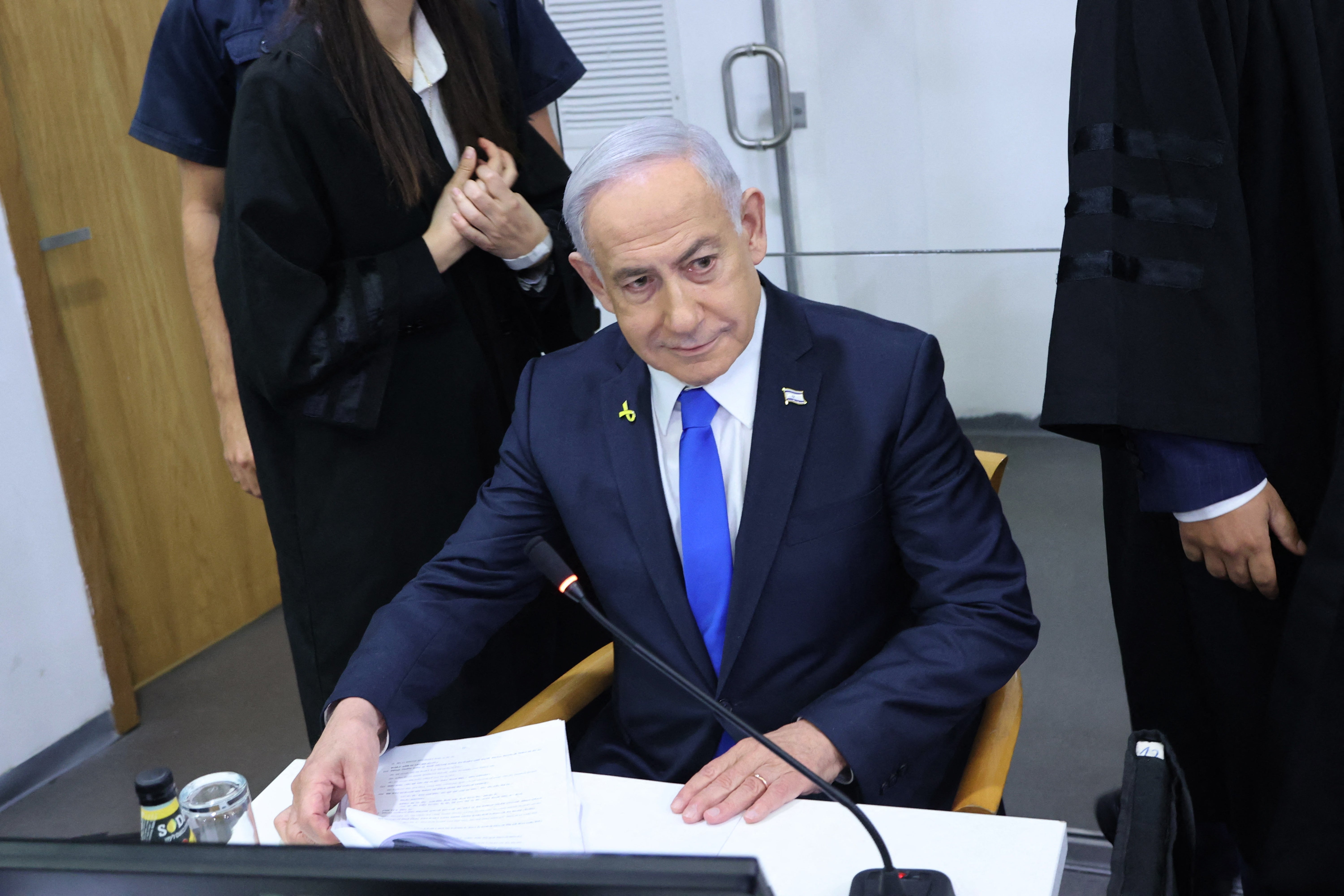 Netanyahu, pictured in April at his trial at the district court in Tel Aviv, faces charges of bribery, fraud and breach of trust. He denies the charges
