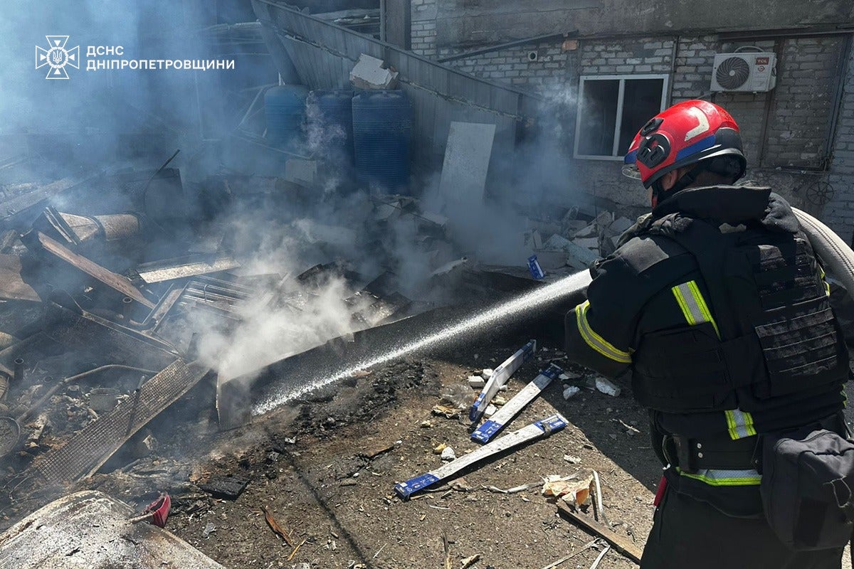 Firefighter battling a blaze at a house in Samar in Dnipropetrovsk Oblast hit by Russian strikes on 24 June