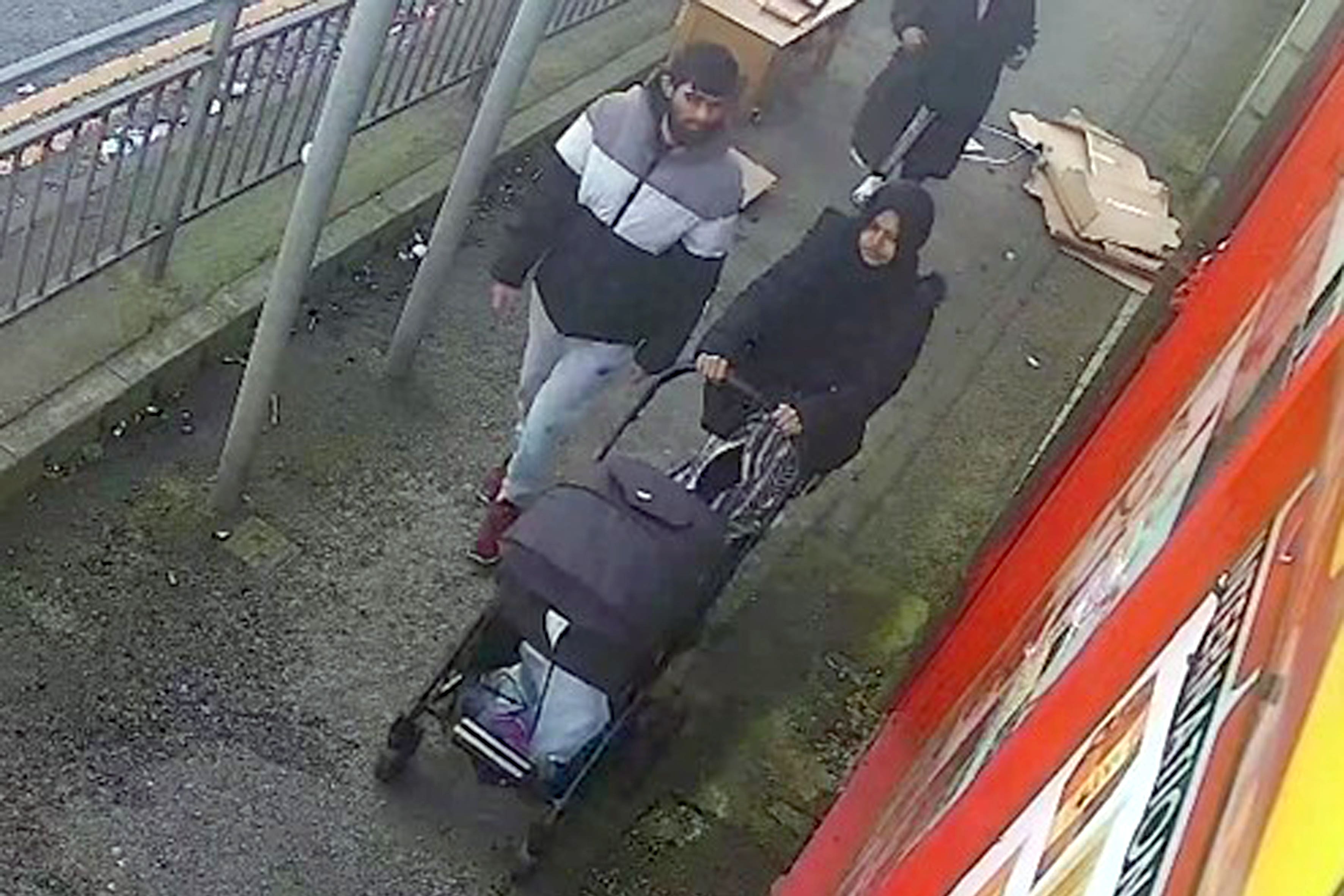 CCTV screengrab of Habibur Masum walking with his wife Kulsuma Akter and their baby (PA)