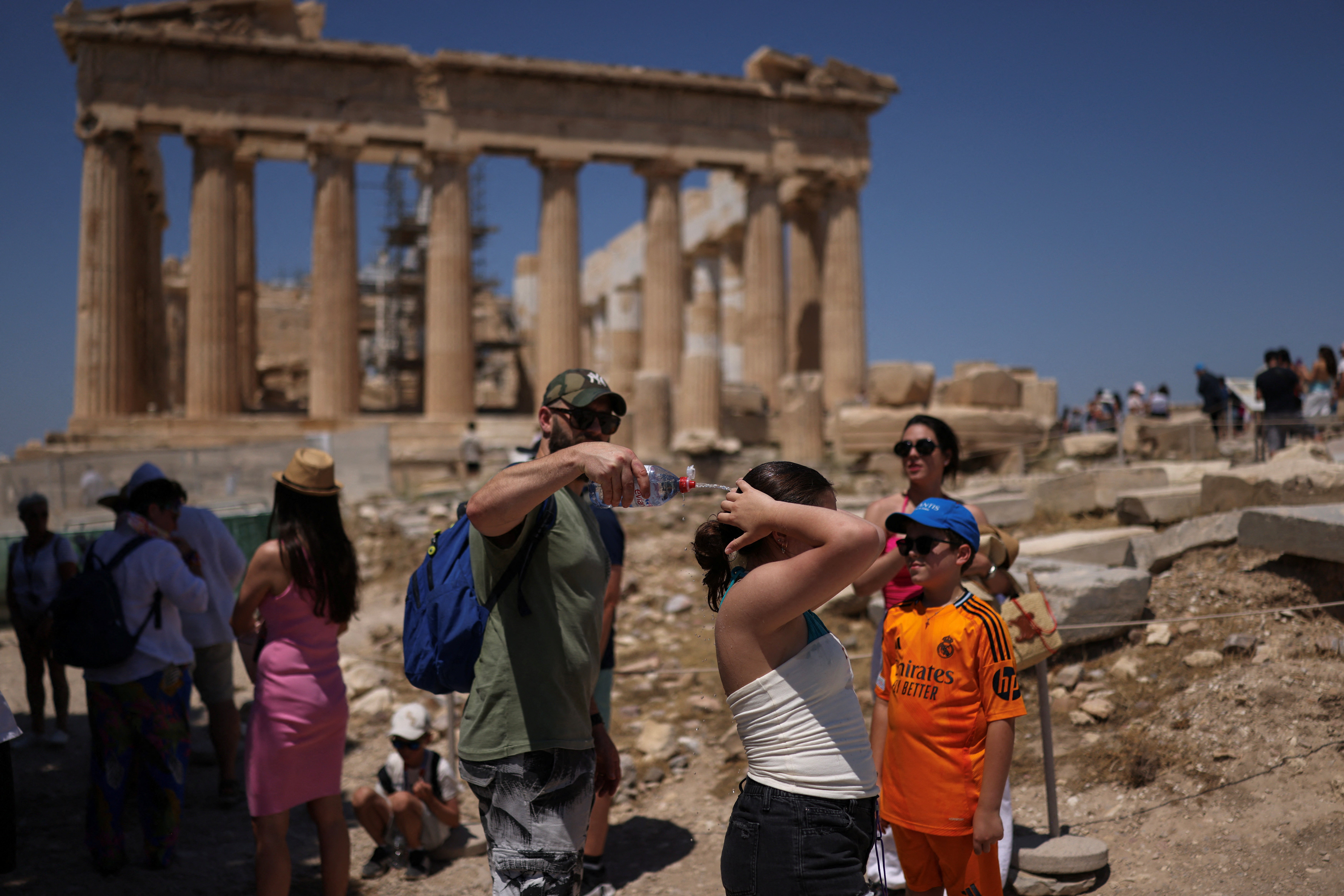 People try to stay cool in Greece during the heatwave