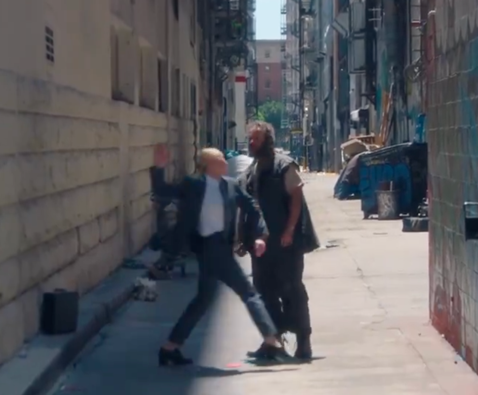 Cate Blanchett winds up to slap a desperate man during a game of ddakji