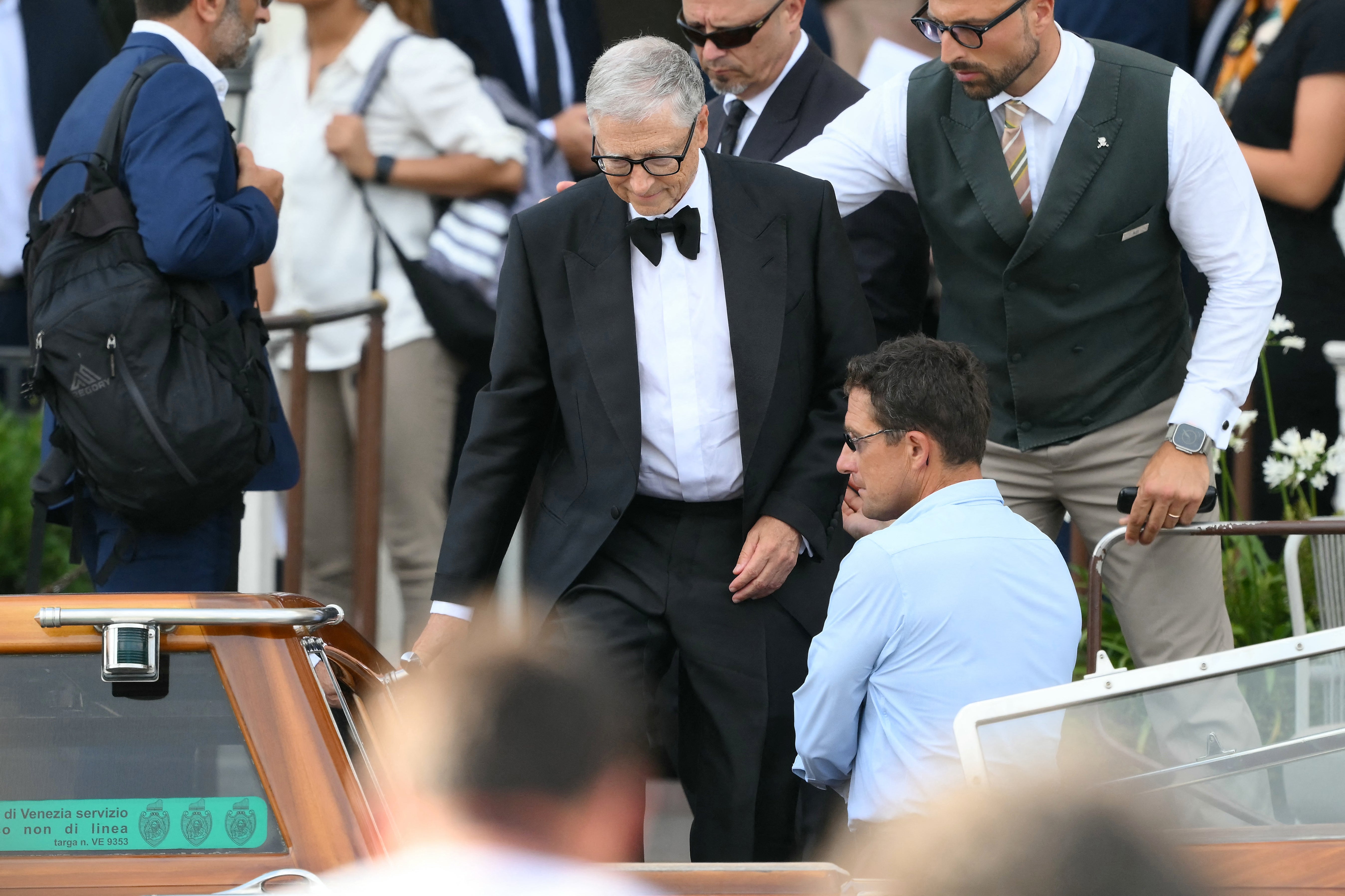 A dapper Bill Gates makes his way to the wedding ceremony