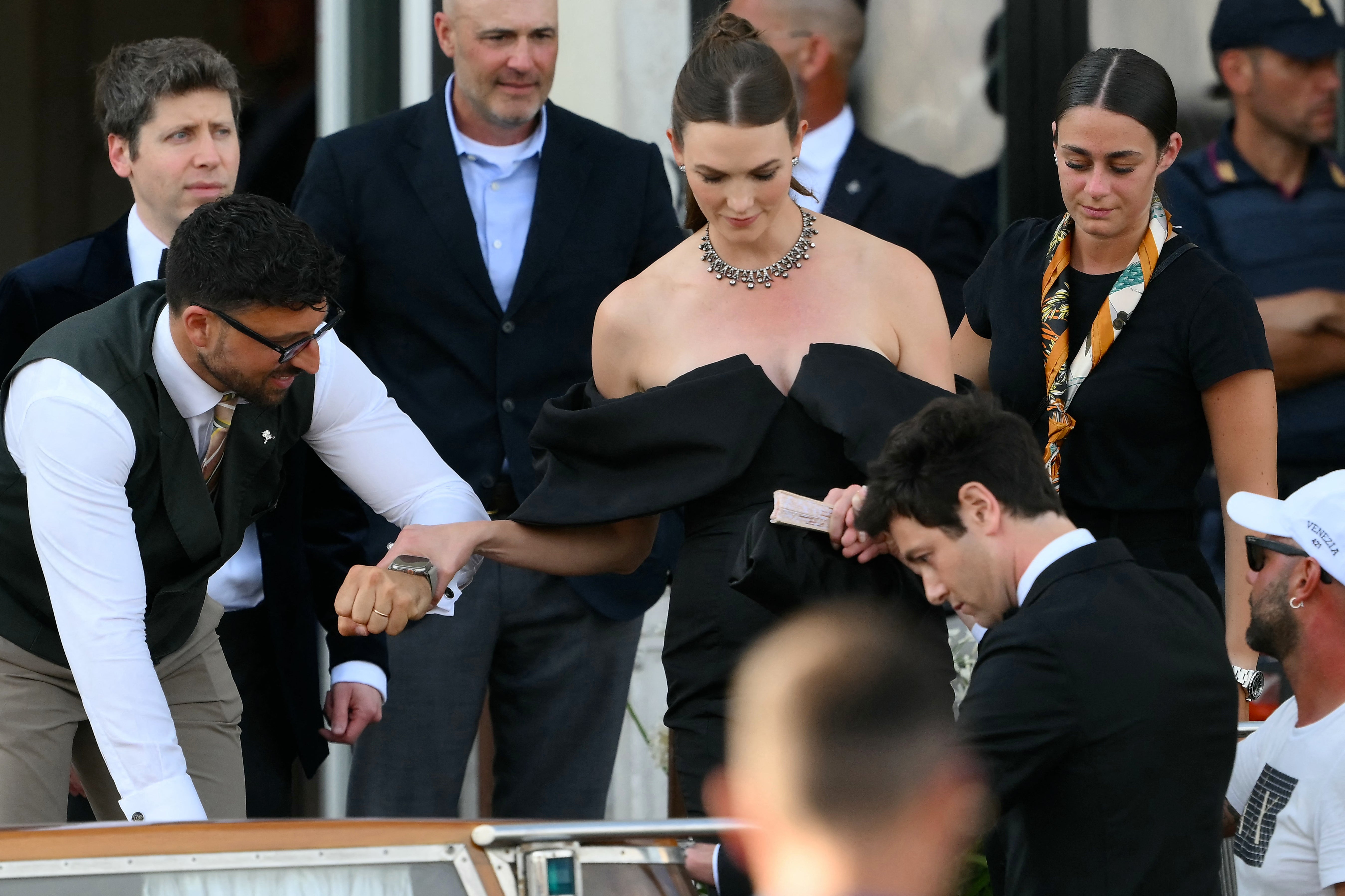 A pregnant Karlie Kloss on her way to the wedding