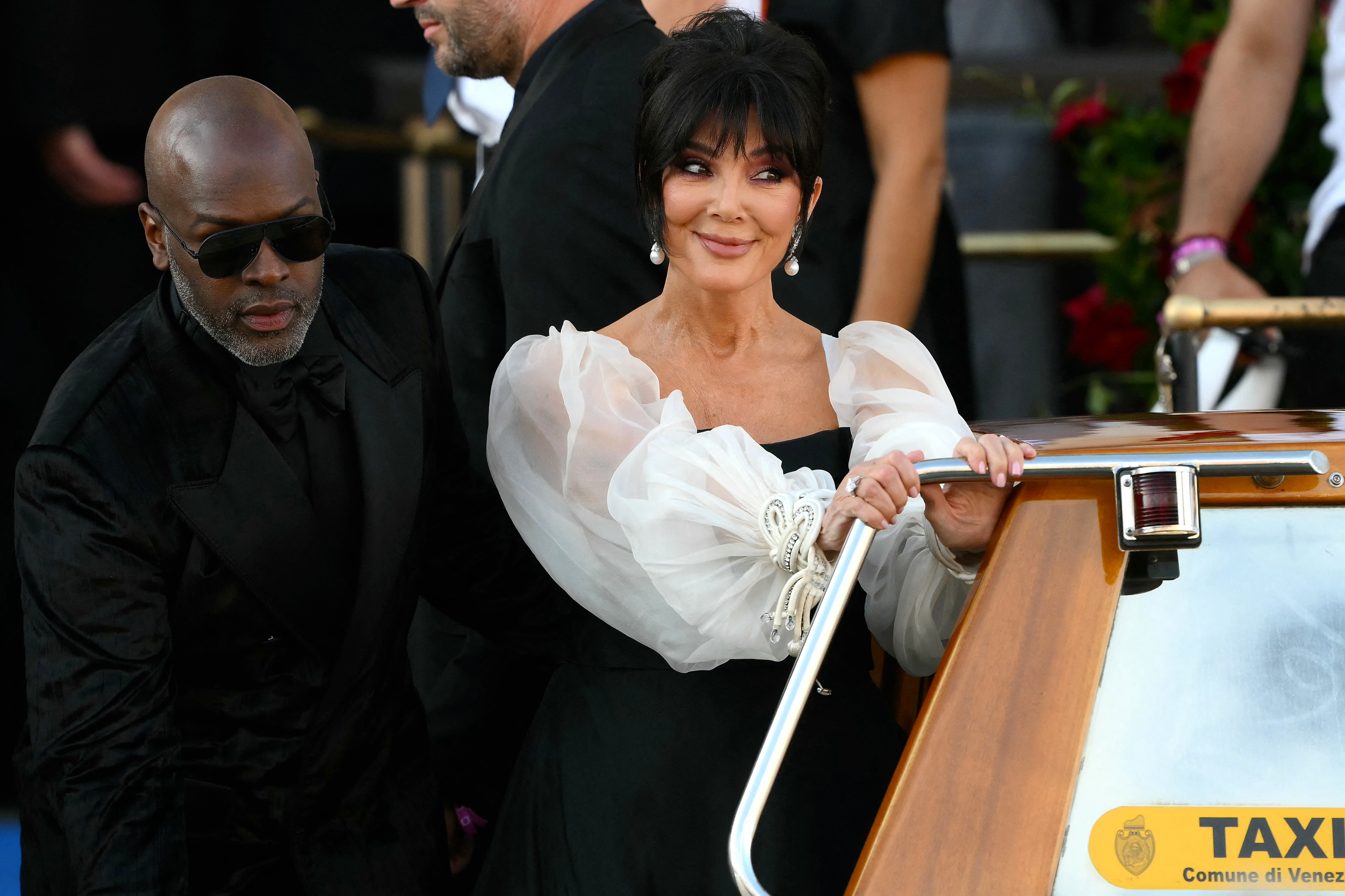 Jenner’s Friday look was a showstopper, channeling ‘Breakfast at Tiffany’s’ in a square-neck, monochrome gown accented by ethereal mesh balloon sleeves.